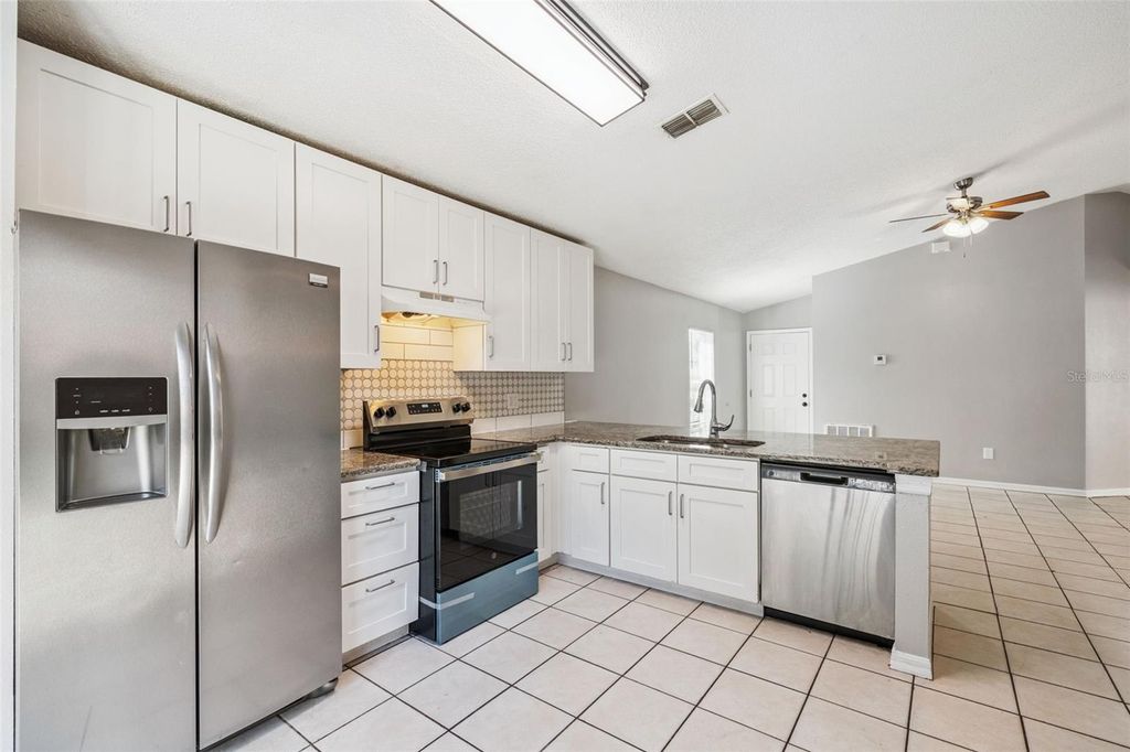 Photo of 5235 Florida Holly Drive, Orlando, FL 32811 (MLS # O6410244)