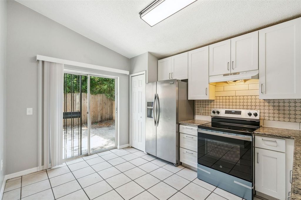 Photo of 5235 Florida Holly Drive, Orlando, FL 32811 (MLS # O6410244)