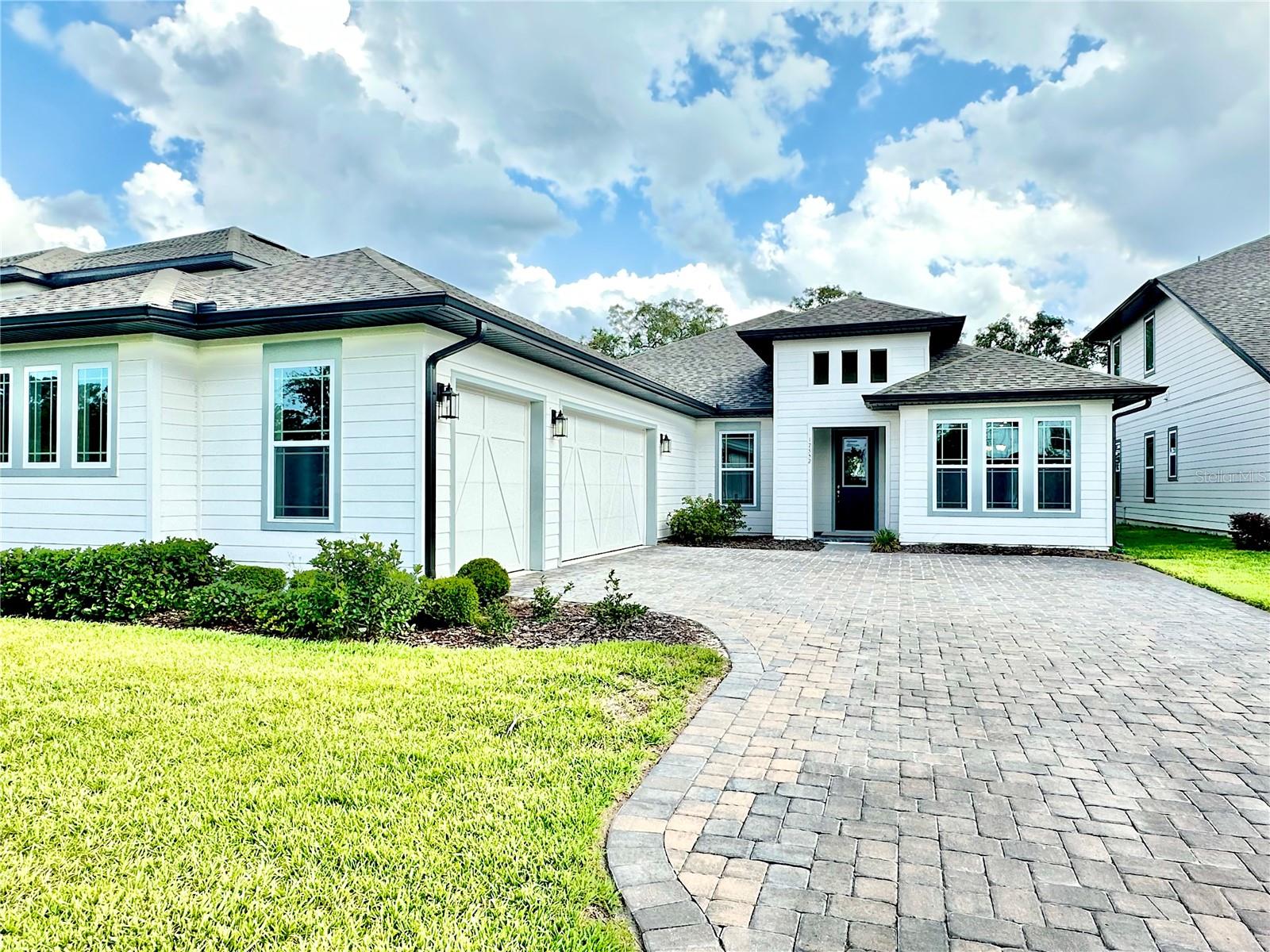 Discover your dream of living in a spectacular, new home located in the coveted Horizon West area of Winter Garden! Imagine enjoying life in this stunning 4-bedroom, 3-bathroom residence with a 3-car garage. Designed with a touch of modernity and a light color palette, this architectural marvel stands out for its open space concept. Brightness spreads through every corner, complemented by a dream kitchen equipped with the best: 42-inch vibrant color shaker cabinets, quartz countertops, a large island perfect for entertaining, and stainless steel appliances including refrigerator, stove, dishwasher, microwave, washer, and dryer. Not to mention the energy-efficient construction. The charming backyard opens up to a large lanai overlooking a conservation area and lake, providing a perfect setting to relax and enjoy the view! This is an opportunity not to be missed. Seize the chance to make this dream a reality. Come see your new dream home today!