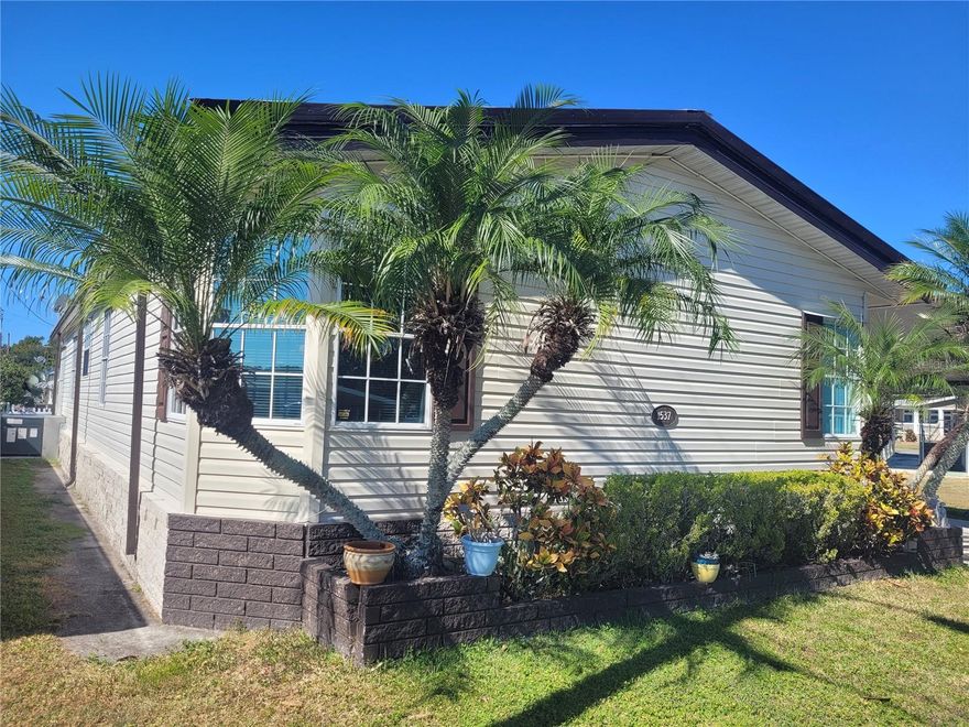 This lovingly cared for newer 1998 double-wide 3/2 split plan with an extra large 15X13 primary bedroom and two large bedrooms has 1,647 square feet of living space in addition to the large Florida room, giving a total living space of 1,907 square feet. The living room/dining room combination AND the separate family room/flex room/craft room provides so much open space for you to fully enjoy this wonderful home. There is luxury vinyl flooring throughout the home with the exception of two carpeted bedrooms. The gorgeous kitchen boasts solid white shaker style cabinets (not thermofoil), and the cozy dinette situated next to the kitchen is perfect for morning coffee or any casual meal, while the formal dining room with large solid wood table and chairs is perfect for meals with family and friends, or game night with friends. Two sheds with plenty of room for storage and big enough to use as a workshop. Tools do not convey; please see attachment which lists all items that are included in the sale as well as the many, many upgrades to this beautiful home, including new AC, refrigerator, washing machine, etc. - the list goes on and on! All additional appliances are new within the last five years.  You will thoroughly enjoy this home and living in Skyview Estates, an active and friendly gated 55+ community with a walking trail, fishing area, community firepit, and dog park. Golf carts are welcome! Large updated clubhouse with a remodeled, well-appointed kitchen is a great way to meet new friends at the many socials and fellowships. Schedule your showing and be sure to check out the attached list of improvements and items that convey with this home.