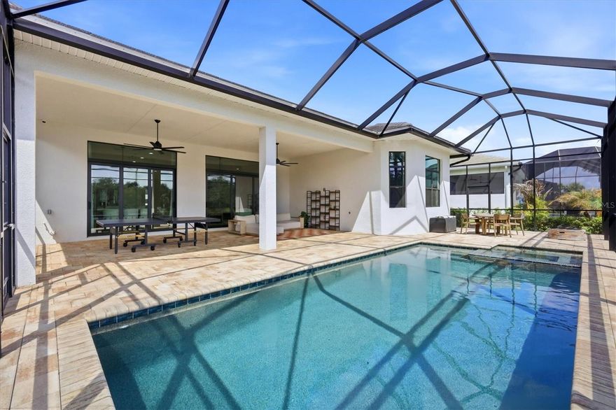 This highly sought-after 3 bedroom + Den and 3 bath model in Artistry Sarasota offers the perfect blend of luxury, privacy, and opportunity—ideal for buyers seeking a refined Sarasota lifestyle with the ability to personalize and elevate the home to their own taste. Perfectly positioned on a tranquil lake with peaceful views of the community nature trail beyond, this property delivers a rare sense of serenity and privacy while remaining just 10 miles from downtown Sarasota.
Designed for seamless indoor-outdoor living, the open-concept floor plan features two expansive sliding glass doors that lead to a private outdoor retreat complete with a saltwater pool and spa. The lanai is already equipped with gas, water, and electric connections for a future outdoor kitchen, creating the perfect foundation for a custom entertaining space tailored to your lifestyle.
Inside, the bright and airy kitchen features quartz, countertops, waterfall counter tops on the island, custom cabinetry, under-sink water filtration, and generous gathering spaces designed for both everyday living and entertaining. A whole-home water softener adds additional comfort and convenience. The spacious primary suite is filled with natural light from elegant bay windows and features a spa-inspired bath with an oversized walk-in shower. A flexible den offers space for a home office, media room, fitness studio, or additional guest accommodations.
Luxury buyers will appreciate the strong architectural foundation, premium homesite, and exceptional location—offering the ability to enhance and curate the interiors over time while already enjoying the best of Florida living today.
Residents of Artistry Sarasota enjoy maintenance-free living and resort-style amenities including a community pool, pickleball courts, basketball courts, playground, and scenic walking trails. Located approximately 10 miles from downtown Sarasota, this home offers convenient access to world-class dining, shopping, arts, golf, and Gulf Coast beaches while maintaining a peaceful residential setting.