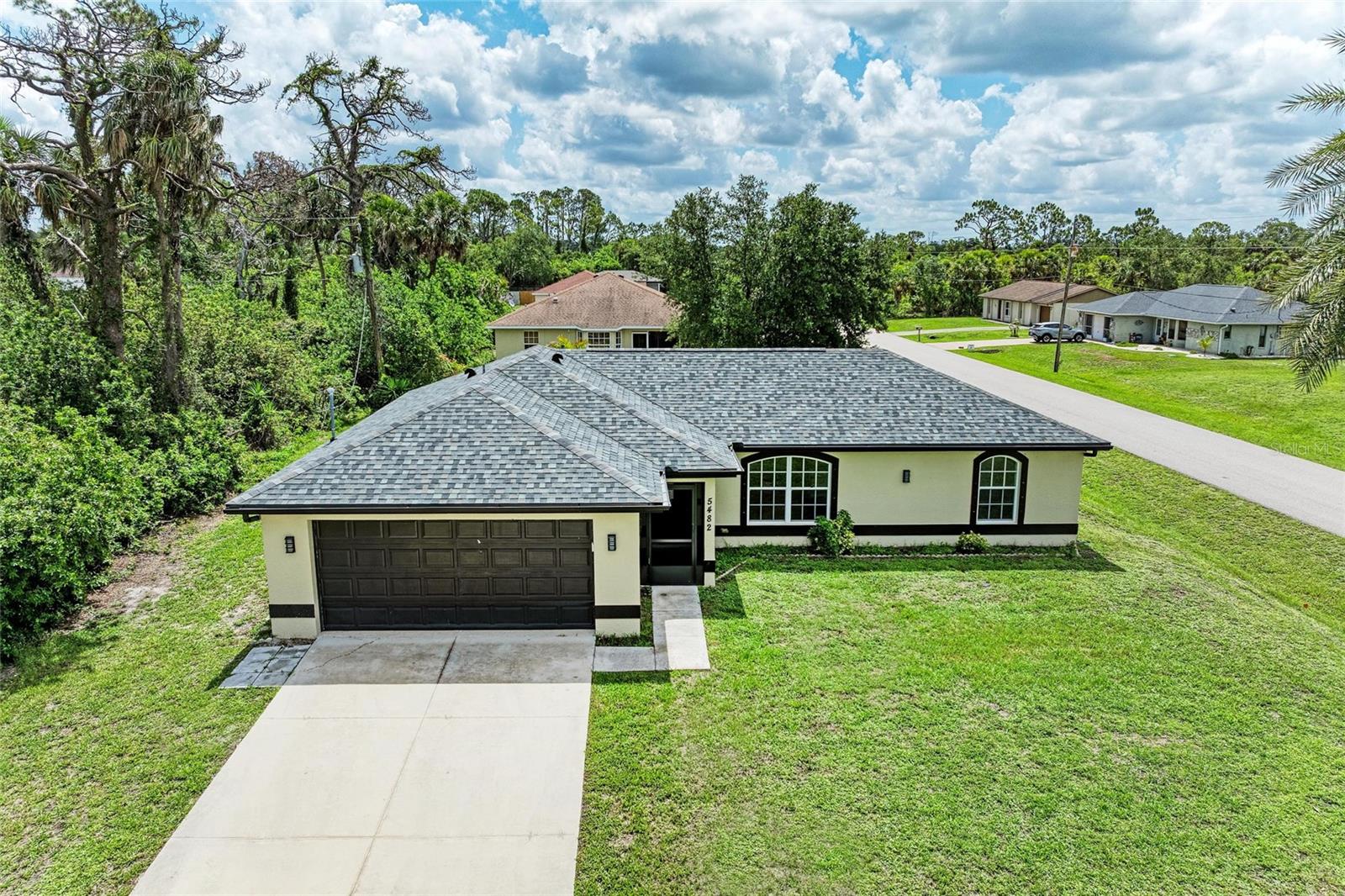 Discover this beautifully renovated 3-bedroom, 2-bathroom home, complete with a versatile bonus game room and a spacious 2-car garage, nestled on a desirable corner lot in a quiet North Port neighborhood.
Step inside to find a bright and open floor plan, featuring stylish finishes and modern upgrades throughout. The home has been recently painted inside, creating a fresh and inviting atmosphere from the moment you walk in. The renovated bathrooms bring a touch of luxury, while the bonus game room provides the perfect space for entertaining, a home office, or a playroom.
The heart of the home—the kitchen—boasts stainless steel appliances, ample cabinet space, and a functional layout ideal for everyday cooking and family gatherings.
Enjoy Florida living at its best with a spacious backyard on a corner lot—perfect for outdoor activities, barbecues, gardening, or simply relaxing in the sunshine.
Recent Upgrades: NEW ROOF (2023), A/C (2021), WATER HEATER (2021), WATER SYSTEM (2022), FRESH INTERIOR PAINT, and MODERN STAINLESS STEEL APPLIANCES—combining style, comfort, and peace of mind.
Prime Location: Ideally situated just 11 minutes from I-75, and only 6 minutes from grocery stores, restaurants, shopping centers, and top-rated schools. Whether you're commuting or running errands, everything you need is within easy reach.
Live the North Port Lifestyle: Known for its natural springs, outdoor recreation, and friendly community, North Port offers the perfect blend of tranquility and convenience—making it one of the fastest-growing and most desirable areas in Southwest Florida.
Close to the Coast: You're just a short drive from beautiful Gulf Coast beaches, including Venice Beach, Manasota Key, and Englewood Beach—perfect for weekend getaways, sunset strolls, or soaking up the Florida sunshine year-round.
Added Peace of Mind: This home is not located in a flood zone.
Don’t miss the opportunity to make this move-in-ready home yours—schedule your private showing today!