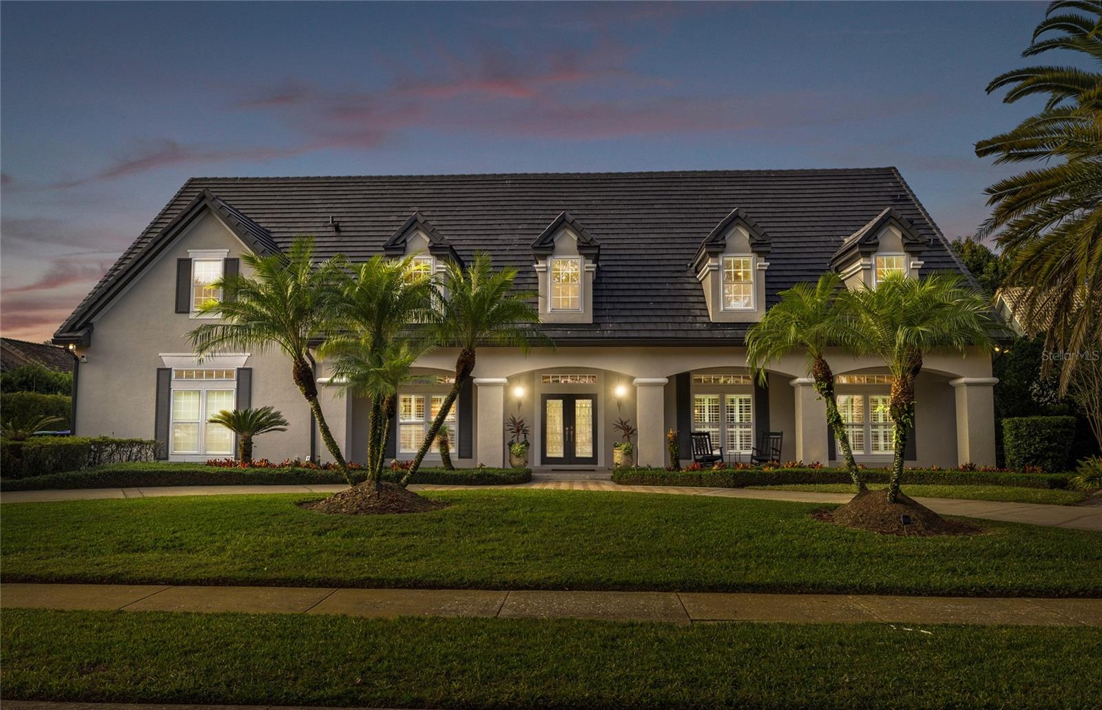 Welcome to this stunning 5-bedroom, 4-bathroom Jones-Clayton custom home
spanning over 4,600 sq ft in the exclusive gated community of Cypress Point!
Thoughtfully updated with over $200,000 in recent upgrades, including a new tile roof,
new A/C units, new windows, and more, this home blends timeless craftsmanship with
modern luxury. The gourmet kitchen has been completely remodeled and features
custom cabinetry, quartz countertops, designer backsplash, WOLF induction cooktop,
MIELE double oven with steamer, MIELE dishwasher, built-in microwave, and a dry bar
with wine fridge. The kitchen and family room flow seamlessly to the lanai through
French doors and sliding pass-through windows, creating the perfect setting for
indoor/outdoor entertaining. The oversized first-floor primary suite offers a sitting area,
French doors to the pool, a huge walk-in closet, and a fully remodeled spa-like ensuite
with double vanities, a soaking tub, large walk-in shower, bidet, and exterior door to the
lanai. A second bedroom near the primary suite includes built-in shelving and a desk
area—ideal for a home office or nursery. Upstairs, you’ll find three additional spacious
bedrooms, each with ensuite bathroom access, plus a large bonus room and a dedicated
theatre room where the screen and short throw projector convey. There’s also an 18x11
ft. under-air storage room perfect for seasonal décor, craft supplies, or sports
memorabilia. The resort-style backyard is an entertainer’s dream with a large screened
pool, outdoor kitchen, and dedicated gardening area. Additional highlights include high
vaulted ceilings, 8-ft interior doors, recessed lighting, circular driveway, 3-car garage,
and a private well for irrigation. The Cypress Point community is nestled on the Butler
Chain of Lakes, offering a clubhouse, lighted tennis and basketball courts, fishing
dock, kayak and paddleboard launch, playground, and walking trails. Located in the
heart of Dr. Phillips, you’ll be minutes from top-rated schools, Restaurant Row world-class dining,
shopping, and Orlando’s premier attractions. Luxury, location, and lifestyle — this Jones-
Clayton masterpiece truly has it all! Schedule your private showing today.