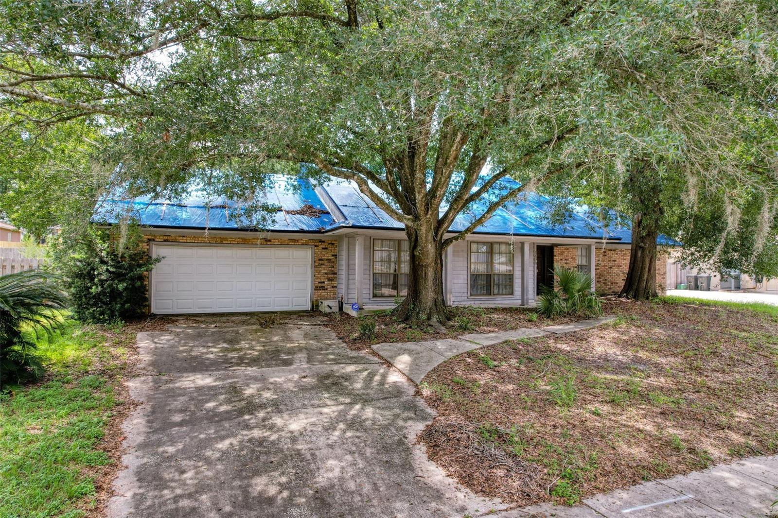 This 4-bedroom, 2-bathroom home in Longwood offers 2,066 sq ft of living space and a spacious layout ready for personalization. Located in a well-established community with a low annual HOA fee of $500, the property features a 2-car attached garage, slab foundation, and an in-ground pool?enhanced by paid-off solar panels for efficient pool heating. Appliances, including a dishwasher, refrigerator, stove, washer, and dryer, are included with the sale.
The home presents a strong value-add opportunity with potential for flooring replacement, cosmetic updates throughout, resodding the lawn, and rescreening the porch. With comparable renovated homes in the area selling up to $550,000, there's solid upside for those looking to build equity through updates. Public water and central air conditioning are already in place, and the property is not in a flood zone.
Whether you're looking to renovate and occupy or invest in a high-demand rental market, this property offers flexibility and potential in a great location.