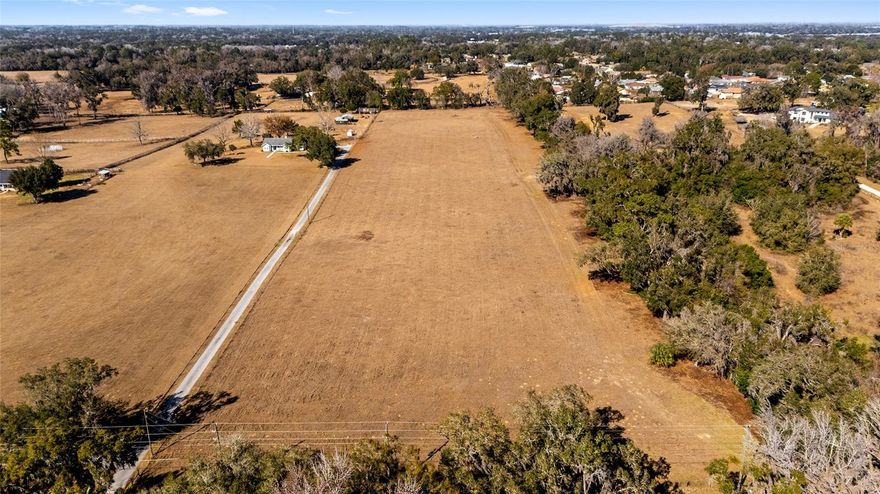 Rare opportunity to own 10 acres of beautiful residential acreage in Belleview, Florida, offering space, privacy, and endless potential. This expansive parcel provides the perfect setting for a custom estate, family compound, or homestead lifestyle.

With plenty of room for a main residence plus guest house, workshop, barns, or recreational amenities, this property is ideal for those who value elbow room and flexibility. Bring your horses, start a hobby farm, plant gardens, or simply enjoy the peace and privacy that large acreage provides.

Conveniently located within easy driving distance of shopping, dining, and medical services in Ocala, Florida, you can enjoy country living without sacrificing accessibility. Larger tracts like this are becoming increasingly hard to find in Marion County, Florida, making this a strong option for both end-users and long-term investors.

Build your dream home, create your private retreat, or hold as a land investment — this 10-acre parcel offers unlimited possibilities.