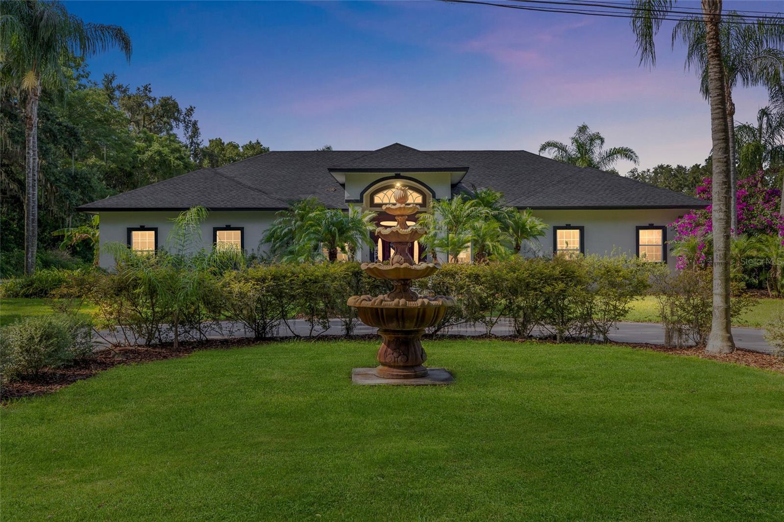 Step into luxury and comfort with this stunning 4 bedroom, 3 bathroom home PLUS a versatile flex room! Located in Lakeland’s highly sought after Ewell road area. This very well maintained single-family residence offers the perfect blend of elegance, functionality, and convenience. From the moment you arrive, you’ll be impressed by the beautifully landscaped yard and inviting curb appeal. Inside, an open concept layout welcomes you with abundant natural light, a mix of and tile and hardwood flooring, and plenty of space for both everyday living and entertaining. The gourmet kitchen is a true showstopper, featuring extended cabinetry, ample counter space, and a large oversized counter tops, this seamlessly connects to the living room perfect for hosting gatherings with family and friends. This home features custom floor plan, situating the bedrooms apart from each other. The spacious Master suite is a private retreat, complete with a luxurious en-suite bathroom and dual walk-in closets. A in home office conveniently right next to master suit and has viewing access to the front yard. Three additional bedrooms, including two more full bathrooms gives flexibility and space for a growing family or visiting guests. Step outside to your private backyard with large back porch that gives way to Huge pool ideal for enjoying Florida’s year-round sunshine. Patio and pool deck have stunning paving stone design. Pool storage and pool bathroom, with electoral and plumbing for future kitchen. Situated in a secluded community tucked away in one of Lakeland secret hideaways. Enjoy a welcoming neighborhood with easy access to shopping, dining, and major roadways. Don’t miss your opportunity to own this exceptional home in one of Lakeland’s premier areas. Schedule your private showing today!