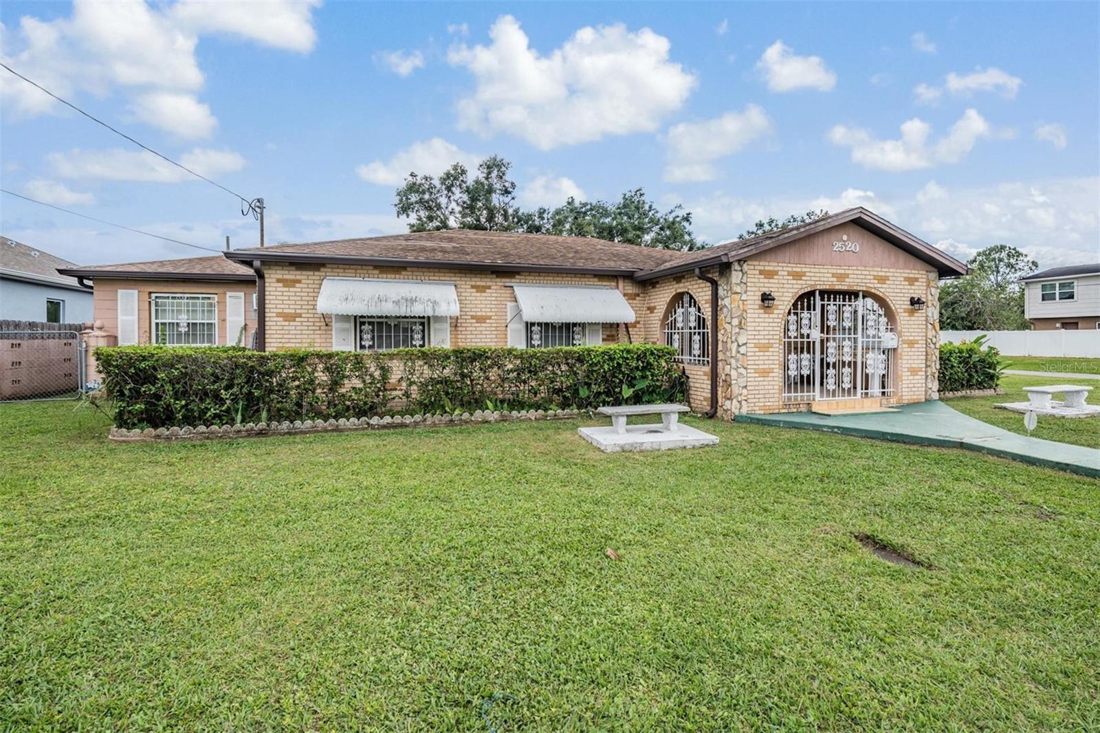 Calling all investors!! Large home on double corner lot in the heart of Tampa!! Amazing space inside and out 1 minute from the highway, 10 mins from downtown Tampa /Ybor and 15 mins from the Airport. Endless opportunity to rehab or rebuild with an oversize lot that could be subdivided. Home is 3 bedrooms and 1 full bath with an in law suite both attached and has a private entrance. Outside storage sheds built onto the garage for lots of storage. Custom archways and molding with character in this 1950s home. Bones and structure are great, as it was well loved! Come make it your own or start over!