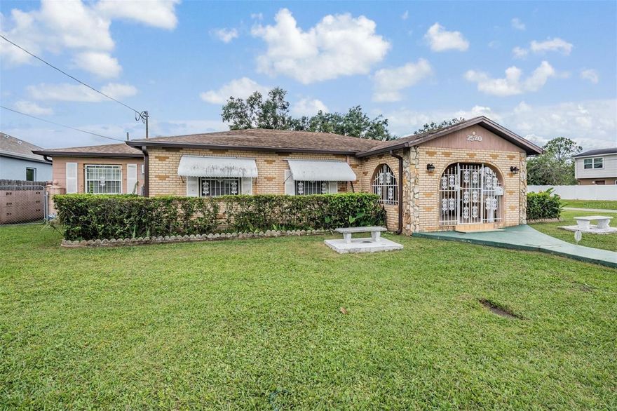 Calling all investors!!  Large home on double corner lot in the heart of Tampa!!  Amazing space inside and out 1 minute from the highway, 10 mins from downtown Tampa /Ybor and 15 mins from the Airport.  Endless opportunity to rehab or rebuild with an oversize lot that could be subdivided.  Home is 3 bedrooms and 1 full bath with an in law suite both attached and has a private entrance.  Outside storage sheds built onto the garage for lots of storage.  Custom archways and molding with character in this 1950s home.  Bones and structure are great, as it was well loved!  Come make it your own or start over!