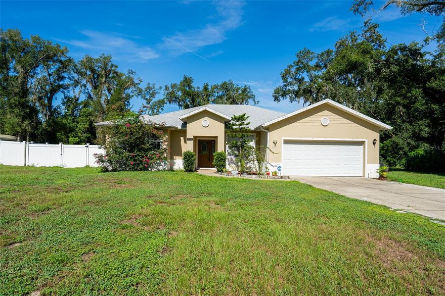 Here's your chance to enjoy space, privacy, and flexibility all while staying connected to everything Central Florida has to offer. Set on over a HALF ACRE in Fruitland Park with no direct rear neighbors, this updated 3-bedroom, 2.5-bath home offers a thoughtful layout and plenty of room to grow. As you enter, you're welcomed by a bright open layout and spacious main living area ideal for relaxing or entertaining. To the right, you'll find a versatile office or den, and to the left, a large primary suite with sliding doors that open to the enclosed back patio. The primary bath includes a walk-in shower and a garden tub for total relaxation. Toward the rear of the home are two additional bedrooms and a shared full bath, completing the split floor plan design. Recent updates include a NEW ROOF and HVAC (2024), and a convenient exterior half bath off the patio, perfect for guests and outdoor use. The seller will have the half bath painted to match the home's interior before closing. Out back, the expansive yard includes a thriving garden filled with fruits, herbs and edible plants, which can either remain or be cleared by the seller upon request. Located just minutes from Leesburg, approximately 35-40 minutes to Downtown Clermont, and about an hour from Orlando, this property offers the best of both worlds: peaceful living with easy access to shopping, dining, and major roadways.