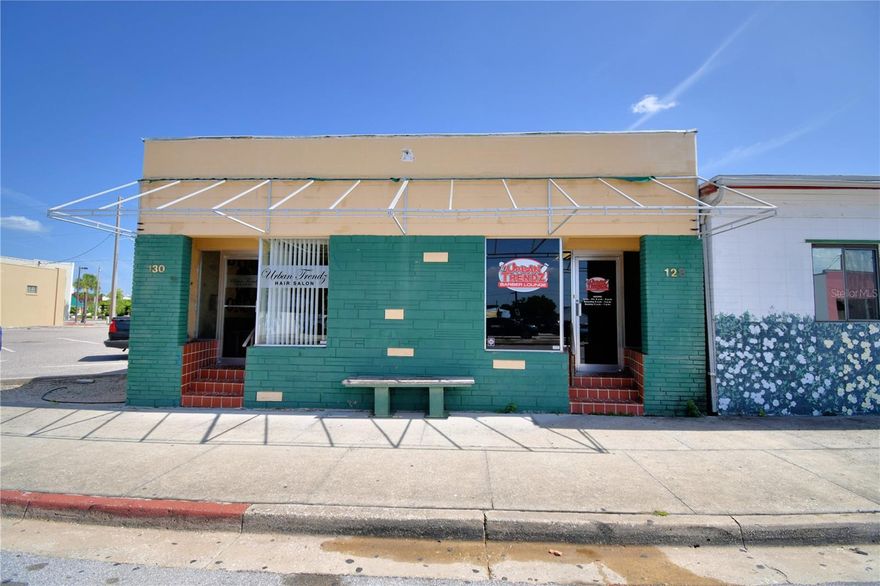 Two-suite commercial building located in downtown Lake Wales, featuring private curbside parking and access to an additional city parking lot. Both units are currently owner occupied. The salon has 2 shampoo sinks and the barbershop as a shampoo backwash. The equipment on both units is optional. The property includes zoned central air conditioning and two separate bathrooms. One ac is 10 years old and the other is 1 year old. The roof is 7 years old. Ideal for investors or owner-occupants—use one suite and lease out the other. Do not enter the property without an appointment as not to bother the owners and customers.