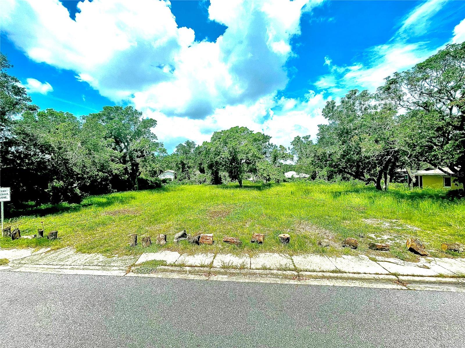 PREMIER 0.637-ACRE MULTI-FAMILY DEVELOPMENT OPPORTUNITY in Downtown Bradenton! Seize this rare 27,768 sq ft vacant lot zoned T4-R (Residential General Urban) for high-density multi-family development. Located in the heart of Bradenton’s vibrant urban core—just a 7-minute walk to LECOM Park, a 15-minute drive to Gulf Coast beaches, and steps from top-rated Ballard Elementary School—this lot is a developer’s dream for a lucrative multi-family project. KEY FEATURES: Flexible T4-R Zoning: Supports multi-family residential (apartments, condos, townhomes) with a maximum allowable density of up to 25 units per acre (approximately 15–16 units on 0.637 acres, subject to site design and city approval), offering significant development potential. Preliminary plans for an 8-plex included to jumpstart your project. Expansive Lot Size: At 0.637 acres, this lot provides ample space for a high-demand multi-family development—ideal for rental income or resale in Bradenton’s thriving market. Unbeatable Location: Minutes from downtown Bradenton’s shops, restaurants, and cultural attractions, with no HOA restrictions for maximum flexibility. HIGH & DRY in X Flood Zone for added peace of mind and potential cost savings. Proximity to Ballard Elementary School enhances appeal for family-oriented residences. Development-Ready: Cleared lot with utilities nearby (buyer to verify), poised for immediate development in a walkable, urban neighborhood. Capitalize on Florida’s booming multi-family demand with this T4-R zoned lot, offering up to 15–16 units of potential and ready-to-go 8-plex plans. Perfect for developers or investors seeking a high-return project in a prime location. Schedule a viewing or request the 8-plex plans today! All development details and zoning permissions should be independently verified with the City of Bradenton. Buyer is responsible for all due diligence.