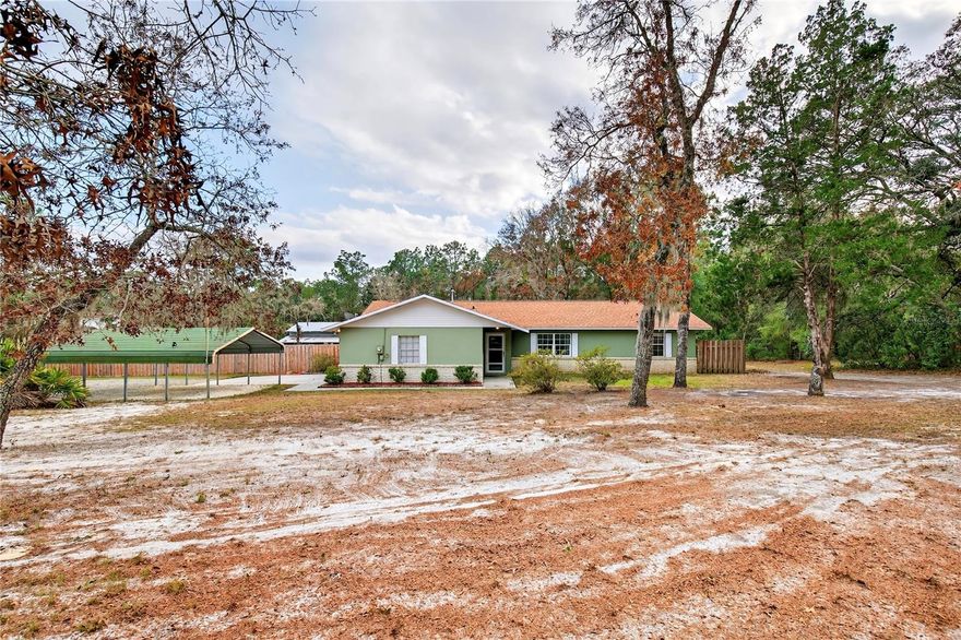 Come Check Out This Private Country Retreat Situated On 5 Acres, ONLY 1 Mile Off Of Highway 200!
This 3 Bedroom, 2 Bathroom Home Is Zoned Agricultural And Sits On A Beautiful Fully Fenced Parcel Offering Space, Privacy, And Endless Possibilities—With NO HOA! As You Arrive At The Property, You’ll Immediately Appreciate The Curb Appeal Of Beautifully Planted Pines Leading You Back To The Tucked-Away Home, Creating A True Sense Of Privacy While Still Offering Easy Access Year-Round. The Exterior Of The Home Was Freshly Painted In 2024, And A Brand New Roof Was Installed In 2023...Giving This Property Excellent Curb Appeal And Peace Of Mind. Making Your Way Inside The Home, You’ll Find A Functional And Comfortable Layout Featuring Three Bedrooms And Two Full Bathrooms. The Home Offers A Cozy Yet Open Feel, Ideal For Everyday Living Or Entertaining. The Split Bedroom Floor Plan Provides Added Privacy, With The Primary Bedroom Separated From The Guest Bedrooms And Featuring A Walk-In Closet.

Major Updates Include: 2025 Roof, 2020 HVAC, New Drain Field In 2021, Stone Driveway Installed In 2023, And A 2022 Hot Water Heater—Making This Home Truly Move-In Ready.

One Of The Standout Features Of This Property Is The Impressive 800 Square Foot Wood Deck Completed In 2024, Perfect For Hosting Gatherings, Enjoying Morning Coffee, Or Simply Taking In The Peaceful Views Of Your Acreage. Outside, The Property Continues To Impress With A Garage Plus Additional Carport Parking, Providing Plenty Of Space For Vehicles, Boats, Or Recreational Toys. The Barn Features Three Bays With High Storage Clearance, Ideal For Equipment, Workshop Space, Or Agricultural Use. The Property Also Includes A Designated Fenced Livestock Area, Previously Used For Cows & Pigs. With Five Fully Fenced Acres, There’s Plenty Of Room For Animals, Toys, Or Future Improvements. What Truly Sets This Property Apart Is Its Location—ONLY 1 Mile Off Of Highway 200 In Ocala, Placing You Just Minutes From Tons Of Brand New Shopping, Restaurants, And Everyday Conveniences While Still Enjoying The Privacy And Space Of Country Living. Easy To Show! Don’t Miss Out On The Opportunity To Make This Property Yours! Call To Schedule Your Private Tour TODAY!