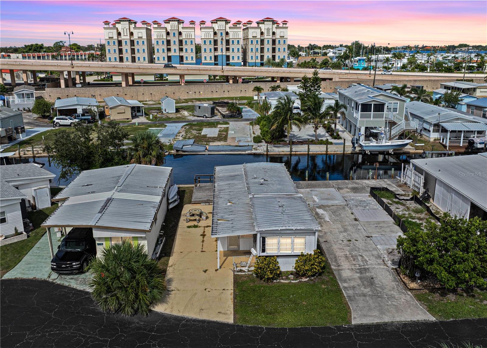 Opportunities like this are rare in Venice, Florida. This 2-bedroom, 2-bath home sits on an exceptional waterfront lot that’s ready for a fresh vision, whether that means a thoughtful renovation or starting new with the custom retreat you’ve always imagined. Boasting 38 feet of canal frontage, private tie-up pilings, and a cement seawall, this property offers easy access to open water. For boaters and water lovers, it’s the chance to live minutes from the Gulf while enjoying the freedom of life on the water every single day. Beyond the canal, the location is simply unbeatable. Just across the bridge lies Historic Downtown Venice, where brick-lined streets are filled with boutique shops, outdoor cafés, and a vibrant calendar of art festivals, concerts, and farmer’s markets. Add in the short drive to Venice Beach and the Pier, and you’ll find yourself in the heart of a true Florida coastal lifestyle. The property itself features a long-paved driveway, a mosaic concrete patio perfect for gatherings, and a wood deck overlooking the water. With the added benefit of a community clubhouse and shuffleboard courts, every day here feels like a vacation. Whether you’re an investor searching for the perfect project or a buyer ready to design your dream home in one of Venice’s most sought-after locations, this is a waterfront opportunity you don’t want to miss. ¤ Please see 3D Tour and Video ¤