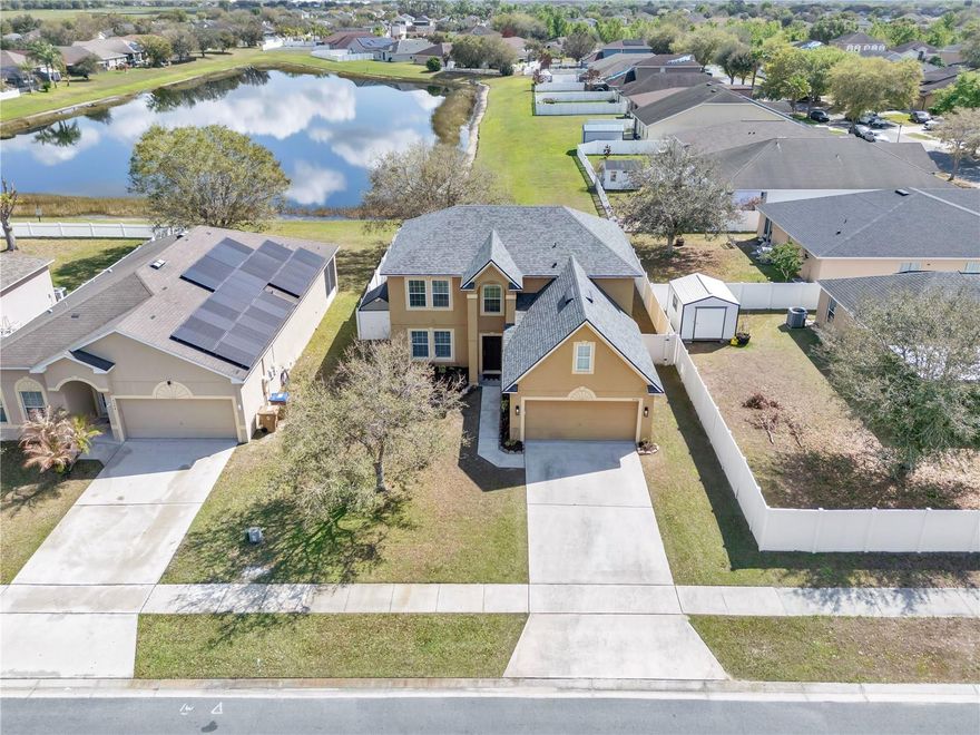 Stunning WATER VIEW HOME on a big lot with a great CURB appeal originally made by Maronda Homes. NEW ROOF 2024, AC 2021, New FLOORS 2024, NEW BATHROOM 2024, NEWER WATER HEATER 2020. Enjoy the comfort in your OVERSIZED MASTER BEDROOM that is complete with a PRIVATE BONUS ROOM that could be used as an office, home gym, library, or perhaps another walk-in closet. The kitchen is large and ready to host some guests or you can bring guests outside onto the large patio deck for some evening time fun. FLEX BONUS ROOM downstairs that has so much potential or could be a 5th bedroom. The Sunrail train station is about a mile down the street from the neighborhood.