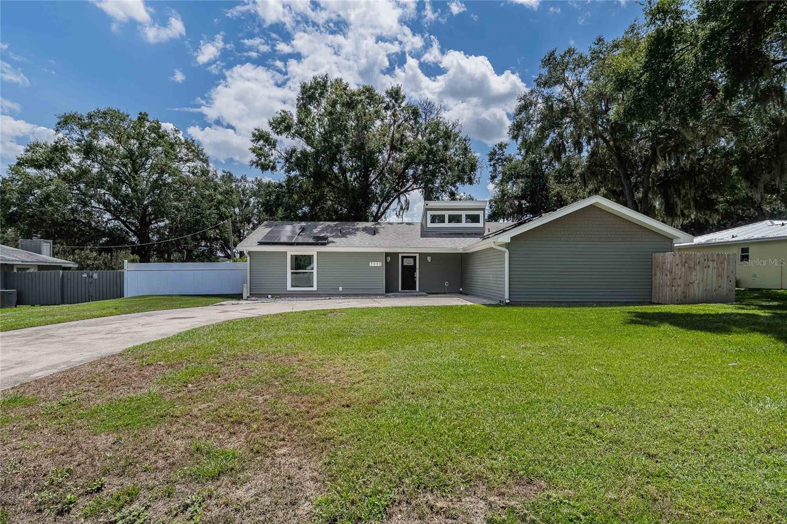 One or more photo(s) has been virtually staged. Welcome Home to 2822 Forestgreen Drive S, Lakeland, FL 33811—a true gem in the tucked away Forestgreen community! This beautifully maintained single-family home features 4 spacious bedrooms and 2.5 baths, offering plenty of room for family, guests, or a home office.
The view from the curb makes this home appear smaller than it is inside. Step inside this bright, sprawling home. The living room features soaring ceilings and dual lighting, ceiling fans fixtures. The dining area is right off the kitchen—for easy entertaining. The kitchen features a walk- in pantry closet and appliances complete with your own wine refrigerator. The primary suite offers a private bath and large walk-in closet, while three additional bedrooms ensure everyone has their own space. For your added comfort and convenience, the laundry room is inside.
Eco-conscious buyers will love the SOLAR panels, providing energy efficiency and lower utility bills.
Outside, the large fenced backyard is ideal for gatherings, gardening, or play. Or retreat to the expansive glass-enclosed sunroom, where you can enjoy year-round relaxation and stunning backyard views, rain or shine.
Located minutes from Lakeside Village, you’ll enjoy easy access to Publix, Target, and local favorites like Fish City Grill and Starbucks. Quick access to major highways makes commuting a breeze.
Don’t miss your chance to own this beautifully upgraded, energy-efficient home in a peaceful, established neighborhood—schedule your private tour today!
Roof:2021