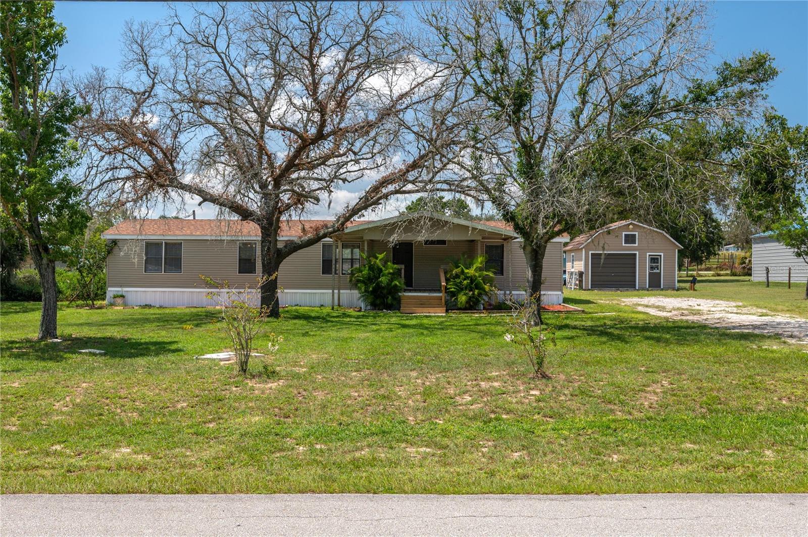 Discover peaceful country living with this well-maintained 3 bedroom, 3 bath mobile home situated on a spaciouss 1-acre lot. Perfect for those seeking a blend of comfort and functionality, this property features a cozy open-concept living area, a bright kitchen with ample storage and a split floor with 2 master bedrooms. The roof is approximately year old and the AC is approximately 2 years old. Enjoy mornings or evenings on the inviting enclosed back porch, ideal for relaxing or entertaining. The acreage offers plenty of room for gardening, pets or outdoor activities, and includes a 20x22 shed, with electric, shelving, storage and rollup door. Wheather you're looking for a serene homestead or a weekend getaway, this property offers space, potential and the charm of rural living--all just a short drive from town. Make your appointment to view this great property.