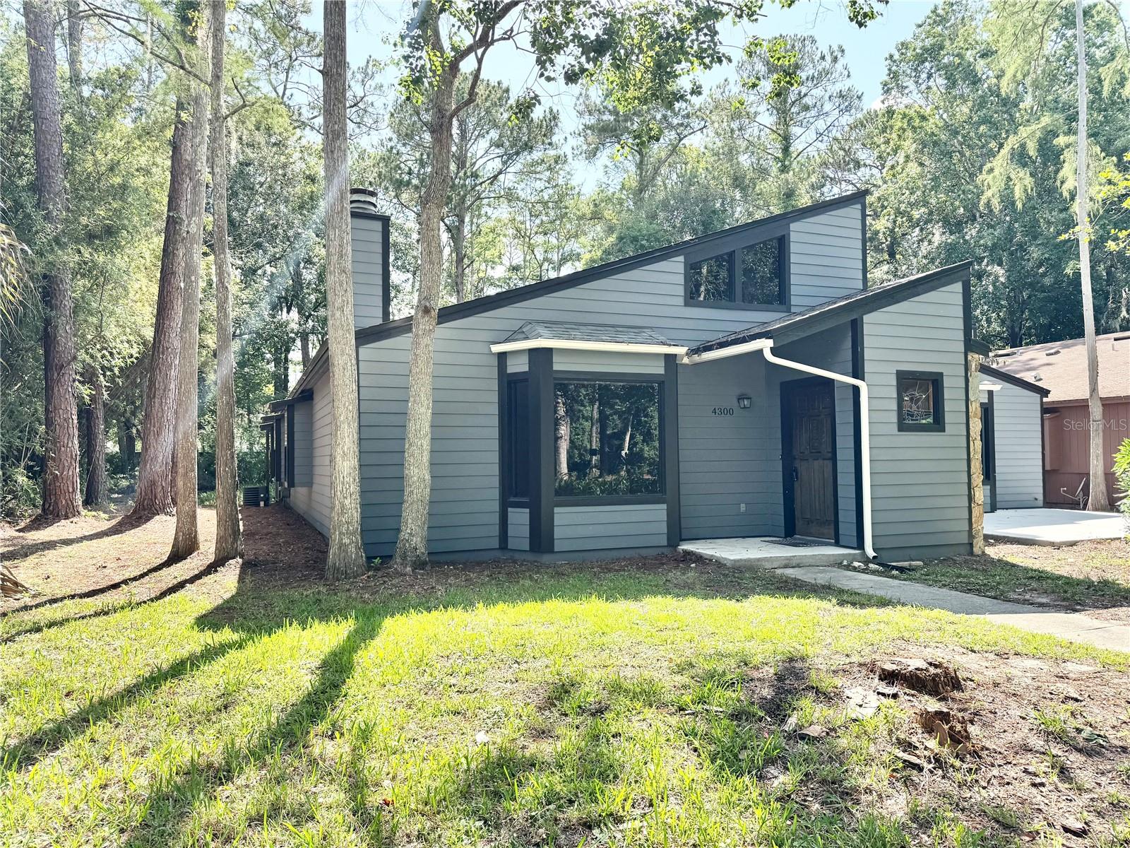 Nothing says cozy more than a spiral staircase and a wood-burning fireplace in the living room. Come check out the completely refreshed exterior, newly painted interior, brand new refrigerator, tile and vinyl flooring throughout and a winding spiral staircase leading to a loft overlooking the Ironwood Golf Course. This home is set apart from other rentals by it's in-home laundry room, loads of bookshelves and a secure storage shed for all your extra belongings. On top of that enjoy a nice backyard with a spacious screened patio area, surrounded by nature and a front yard on the end of a quiet cul-de-sac, adding tranquility to your daily life. It's also a great location being close to the airport, bus routes, shopping, Main Street, and just under 15 minutes to the University of Florida. Call today!