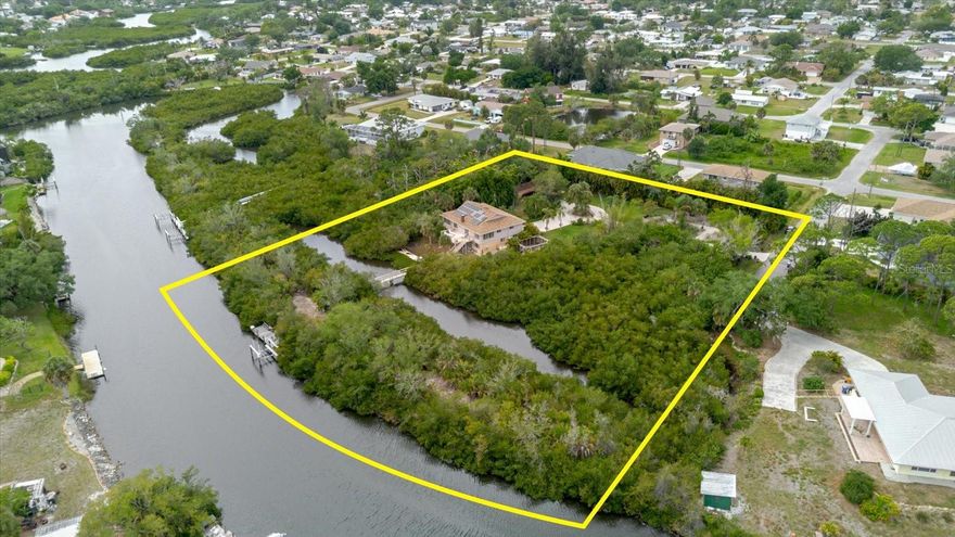 Once in a generation does a property like this come to market.
Commanding over 2 acres of private waterfront land at the end of a quiet cul-de-sac, 4190 Strombus Road is a fully self-sufficient, meticulously upgraded estate that defies comparison. Three combined parcels exceeding 2 acres deliver the space, privacy, and versatility virtually impossible to find in Southwest Florida.
Pass through the electric gated entrance framed by live areca fencing, 33+ fruit trees, a caged vegetable garden, and a chicken coop — engineered for those who demand complete independence. A 100-foot footbridge leads to your own private detached island. A 8,000 lb boat lift and private dock with water and electricity provide direct access to Alligator Creek and the waterways of Southwest Florida. South Venice Beach Ferry access via annual residential pass with optional boat launch. Beach access less than 5 minutes away.
The 2,312 SF 2-story masonry foundation residence features 4 bedrooms, 3 full bathrooms including a 2024 walk-in shower, wood-burning fireplace, 2 skylights, dumbwaiter, open concept kitchen and living areas, home office, game/recreation room, family room, wrap-around balcony, upper deck with awning, screened lower lanai, and a 2-car garage plus carport. Included appliances and stairlift add immediate convenience. Nearly $500,000 in documented improvements — serious, deliberate infrastructure investment.
Built to operate through anything Florida delivers. The 2025 Garrison Flood Barrier System, impact hurricane windows, Storm Smart lanai protection, and harmonic entry shutter deliver unmatched storm defense. Power independence is absolute: 25 solar panels, 2018 solar installation, Tesla Battery (2025), 250-gallon propane tank, and a whole-home Generac generator. Well water, upgraded 2021 septic, 500-gallon rainwater tank, and dual irrigation complete a genuinely off-grid capable estate.
Recent improvements: new roof (2022), two new A/C systems, new water system, full downstairs renovation with Peel & Stick beneath HardiBoard walls, epoxy flooring, raised electrical to 6 feet, new interior doors, new lower bathroom, exterior paint (all 2024), new garage doors (2023), and overhead garage storage (2025). 6-camera security, central vacuum, and UV water filter throughout.
Residents enjoy the Legacy Trail — connecting Venice to Sarasota — and South Venice Civic Association membership with pickleball and year-round amenities. Zoned OUC/Open Use Conservation. A-rated Venice schools: Elementary, Middle, and Senior High.
This is not a property for every buyer — it is the right property for exactly the right buyer. 4190 Strombus Road represents 22 years of vision realized. That vision is now yours to inherit.
See attached Features Sheet and Property FAQ for complete improvements and specifications.