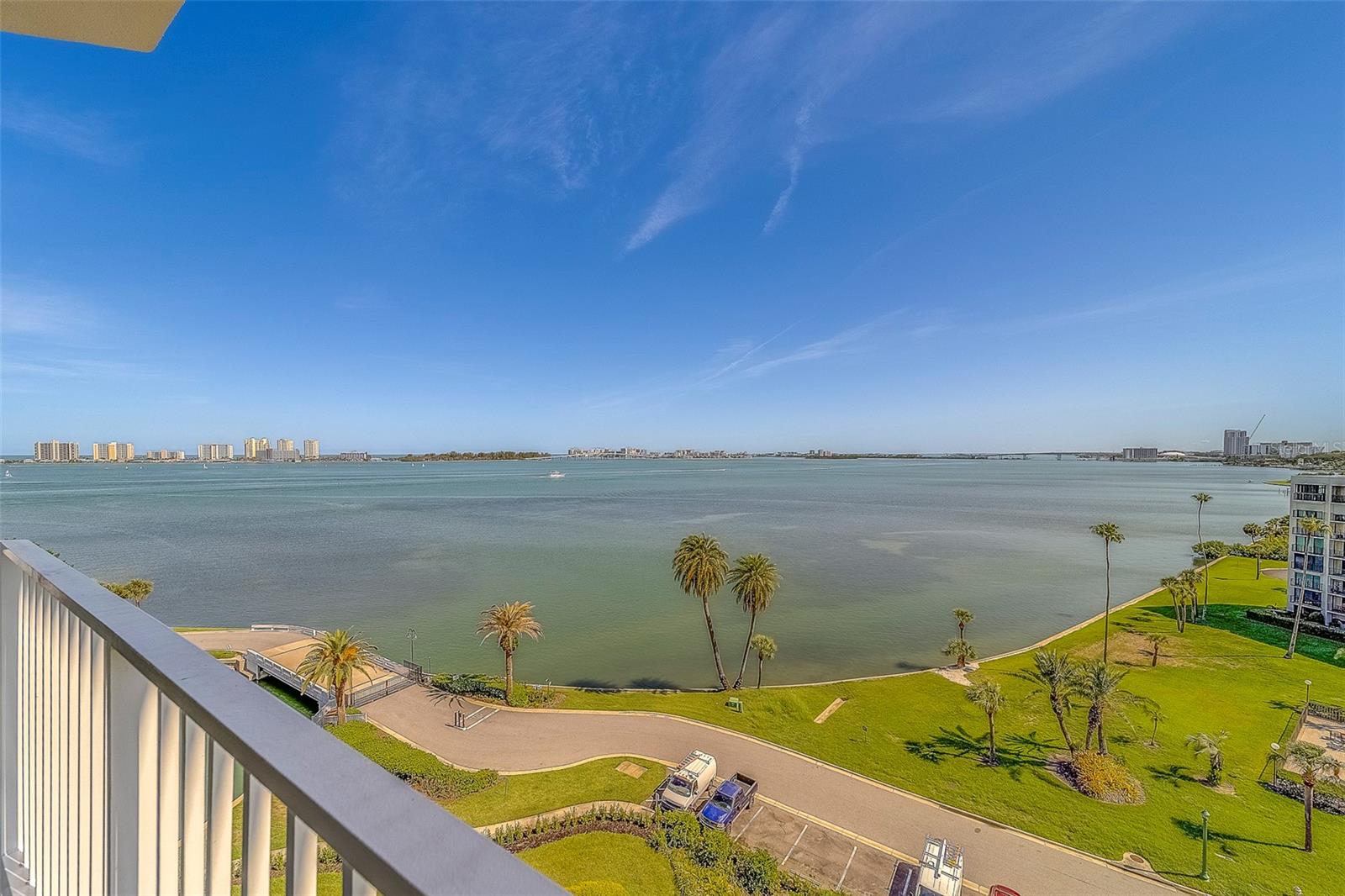 “WELCOME HOME TO A PLACE SO GRAND, WHERE THE SEA MEETS THE GOLDEN SAND” Seaside II, Unit 801 at Belleair is a rare waterfront Penthouse with amazing views located in the enclave of the members-only Belleair Country Club. This Hooker Furniture brand furnished, private corner unit welcomes you through a keyless double door entry and foyer. Open concept living areas with premium luxury flooring and crown molding along with a spacious kitchen, custom cabinetry, high level granite counters and appliances including a wine bar. A new water filtration system and tankless water heater are included with a fully equipped separate laundry room and sink. A romantic primary retreat with en-suite master bath offering double sink vanities, natural light make-up area, soaking tub, spacious shower and double walk-in closets. Your special guests will love their private suite with a full bath and walk-in closet. A third bedroom offers a full closet with Murphy Bed and en-suite bath along with room for home office amenities. This Penthouse suite at Seaside II offers new storm shutters and under building parking for two vehicles along with a large storage area, plus on-site building maintenance with private gated entry. Beautifully landscaped common areas border the heated pool and hot tub. Join the Belleair Country Club and enjoy the fine dining or the relaxed atmosphere at the bar listening to live music. Play a round of golf while family members take advantage of the state-of-the-art fitness center for swimming, tennis or pickleball. The Belleair Country Club Marina has boat lifts and slips available for lease. Welcome Home!!