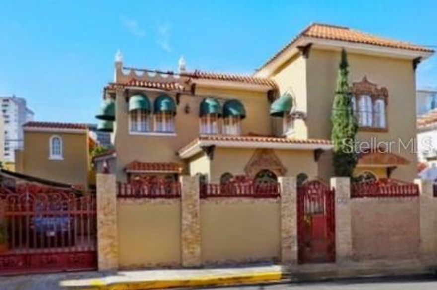 Architectural gem for sale in Condado could be yours!This Spanish Colonial Revival-style house features an impressive façade adorned with a wrought iron fence embellished with 'Flor de Lis' details, terracotta roof tiles, and arched   stained glass windows. Upon entering the foyer, you'll be impressed by the high ceilings, hanging chandelier, terrazzo floors, and the stunning wrought iron staircase leading to the second level. The two story home of 3,557 square-foot sits on a lot of 397.75 square-meter and includes on the first floor the balcony, living room, dining room, family room, kitchen,  breakfast table, a wet bar ideal for entertaining and a full bathroom. On the second level, there are 4 spacious bedrooms with 3 bathrooms. The house features an automatic 65 KLV power plant, a 60-gallon water cistern, a two-car garage, and a maid's room with its own bathroom. Its enviable location is steps away from renowned schools such as St. John's and Robinson, supermarkets, restaurants, hotels, Antonia Quiñones Park “Parque De Condado”, Ashford Presbyterian Hospital, and a short drive from the airport. Don't miss this rare opportunity to live in this elegant Spanish Colonial Revival-style home.