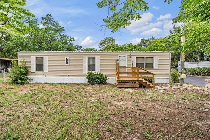 COME ENJOY THE COUNTRY LIFE ON THIS GORGEOUS PROPERTY WITH A SPARKLING HUGE IN GROUND ENCLOSED POOL!
NEW VINYL SIDING has been installed and it looks fantastic!  This wonderful home sits high and dry, NO FLOOD ZONE. There is NO HOA and plenty of room for all your toys. The lot is larger than many in the neighborhood, .62 acres and goes all the way back to Kent Rd. With the OVERSIZED DRIVEWAY, FENCED YARD AND STORAGE SHED YOU CAN BRING THE BOAT, RV, JET SKI AND MORE!  The interior has been tasteful remodeled. It includes a NEW KITCHEN WITH STUNNING GRANITE AND NEW CABINETS. Throughout the home there is NEW LUXURY PLANK VINYL FLOORS. With 3 BEDROOMS AND 2 BATHROOMS, a large kitchen and spacious living room, you will have everything you need for a full time home, vacation getaway, or rental opportunity. Get ready for cookouts and good times! The POOL IS GORGEOUS and the outdoor setting offers privacy and your own retreat and some quiet country charm.