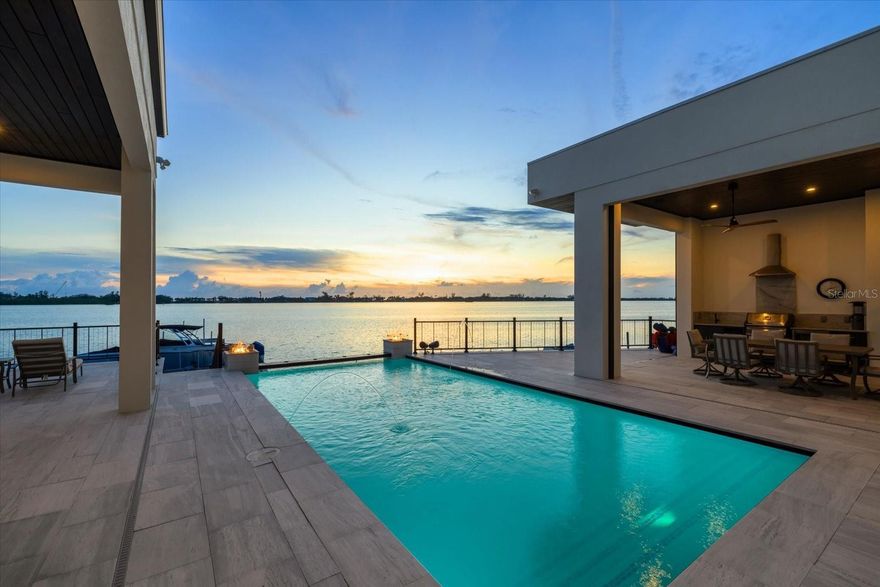 New Seawall / Waterside deck, New Automated Gate, Lanai  Automated Screens

Commanding over half an acre with 116 feet of pristine frontage on Little Sarasota Bay, this brand-new custom estate captures the essence of coastal luxury. From the moment you arrive, you are greeted by sweeping water views and spectacular Casey Key sunsets, setting the stage for an extraordinary lifestyle.

Designed for the boating connoisseur, the property boasts a new dock with water, electric, a 20,000 lb boat lift, and direct bay access—no bridges to the Gulf.

For the automotive enthusiast, a 1,400 sq. ft. climate-controlled garage with 14-ft ceilings, professional-grade car lifts, epoxy floors,  perfect showcase for your collection.

Inside, the home flows across two levels with 3 ensuite bedrooms, 4.5 baths, an office, and a dramatic 24-ft coffered ceiling living room. The chef’s kitchen is an entertainer’s dream, featuring two massive islands, bespoke Yoder cabinetry with stainless steel inlays, and Bertazzoni appliances imported from Italy.

The primary suite is a private retreat with a spa-inspired bath, custom walnut cabinetry, dual shower with body jets, and a grand walk-in closet. Each guest suite offers its own spa-like bath.

Constructed with poured concrete walls coated in Styrofoam and stucco for superior soundproofing, this residence offers both durability and comfort. Additional features include two central A/C systems, top-of-the-line sound and camera security, hurricane-resistant 14-ft ASL garage door, computerized pool controls, custom floors, bar area, 1,000-gallon LP tank, and UV-protected screens.

Outdoor living is nothing short of exceptional, a custom waterfall pool (oriented east–west for optimal sun), spa, fire bowls, LED-lit fountain, and a full pool bath create the ultimate entertaining environment with an unforgettable bayfront backdrop. The new fenced and paved driveway ensures privacy and curb appeal, while the turnkey condition makes it move-in ready.

Located just minutes from Casey Key, Siesta Key Beach, and the A+ rated Pine View School, this estate is more than a home, it’s a statement of refined living, where boating, entertaining, and coastal elegance converge.