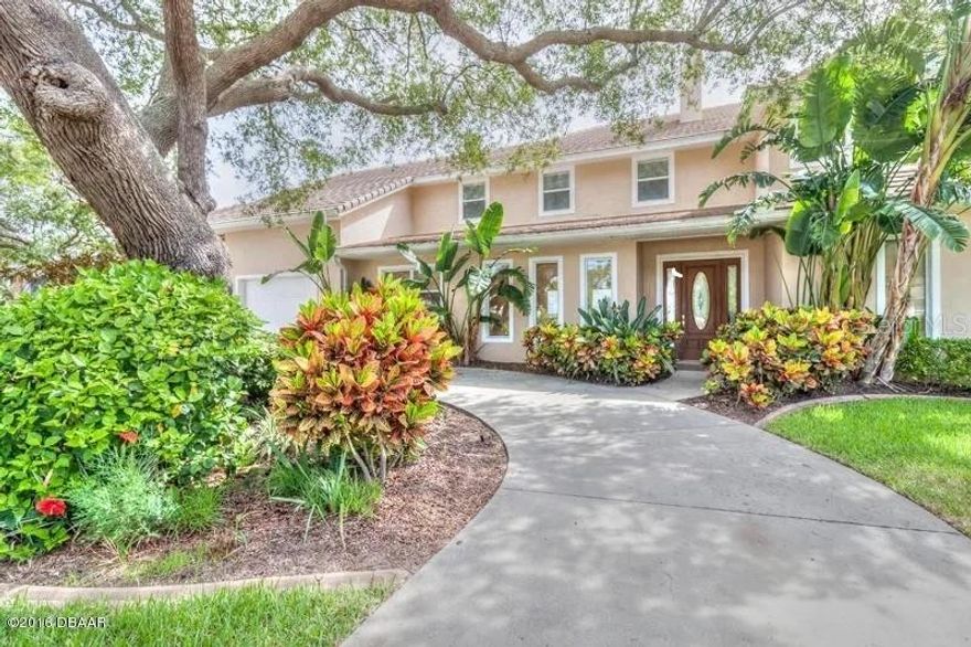 Breathtaking riverfront home with panoramic Intracoastal views from nearly every room. This custom-built 2002 residence offers over 3,500 sq ft of living space and nearly 6,000 sq ft under roof. The open granite kitchen flows seamlessly into the family and dining areas, with soaring 12' ceilings and a wall of sliders overlooking the pool and river. The first-floor master suite enjoys private poolside views, while an upstairs great room features a fireplace, wet bar, and expansive covered lanai—perfect for entertaining with skyline views. The 4–6 car garage was designed for collectors, with 20' ceilings and commercial doors to accommodate lifts. Enjoy luxury finishes, a private pool/spa, and direct Intracoastal frontage complete with a private dock and boat lift for effortless access to the water. A must-see riverfront retreat combining elegance, function, and lifestyle.