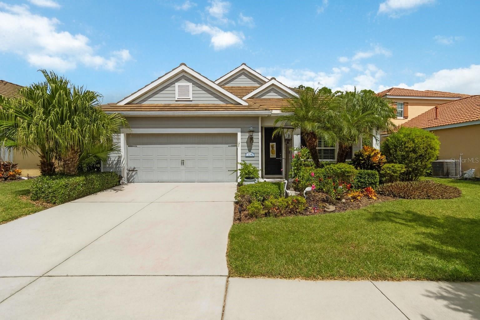 Welcome home to Grand Palm, one of Venice’s most sought-after gated communities! This beautiful residence combines modern finishes, flexible living spaces, and resort-style amenities—all just minutes from Venice Beach and Wellen Park. Property Highlights: Open-concept design, high ceilings & 8 ft doors, Bright and spacious kitchen, living, and dining areas. Gourmet kitchen: Quartz countertops, large island, tile backsplash, under-cabinet lighting, walk-in pantry, and GE stainless steel appliances with natural gas stove (one of the few neighborhoods with natural gas). Primary retreat: Walk-in closet with built-in organizer, dual vanities, and a luxurious tile & glass shower. Additional bedrooms: Two generously sized guest bedrooms plus a full guest bath with tile shower. Bonus space: Perfect for an office, den, or second living area. Outdoor living: Covered, caged paver lanai with a Clearview Panoramic Screen overlooking a peaceful conservation lot. Newly added tropical landscaping provides natural privacy and curb appeal. Charming curb appeal: Enjoy relaxing evenings on the quaint front porch. Attached garage with fresh, clean epoxy floor. Community Lifestyle-Grand Palm offers low HOA fees and incredible amenities: 3 community pools (including lap pool & slide pool), 2 hot tubs/spas, Updated fitness center, 26+ miles of trails, Adventure Lake with kayak storage & numerous fishing spots, playgrounds, splash pad, and community parks. Tennis, pickleball, bocce, basketball & sand volleyball. Weekly food trucks + full-time activities director. Just 9 miles from historic downtown Venice & Venice Beach. Minutes to downtown Wellen Park for dining, shopping, and events. Located in unincorporated Sarasota County giving you lower property taxes than many surrounding areas. Move in ready with some furnishings/furniture negotiable.