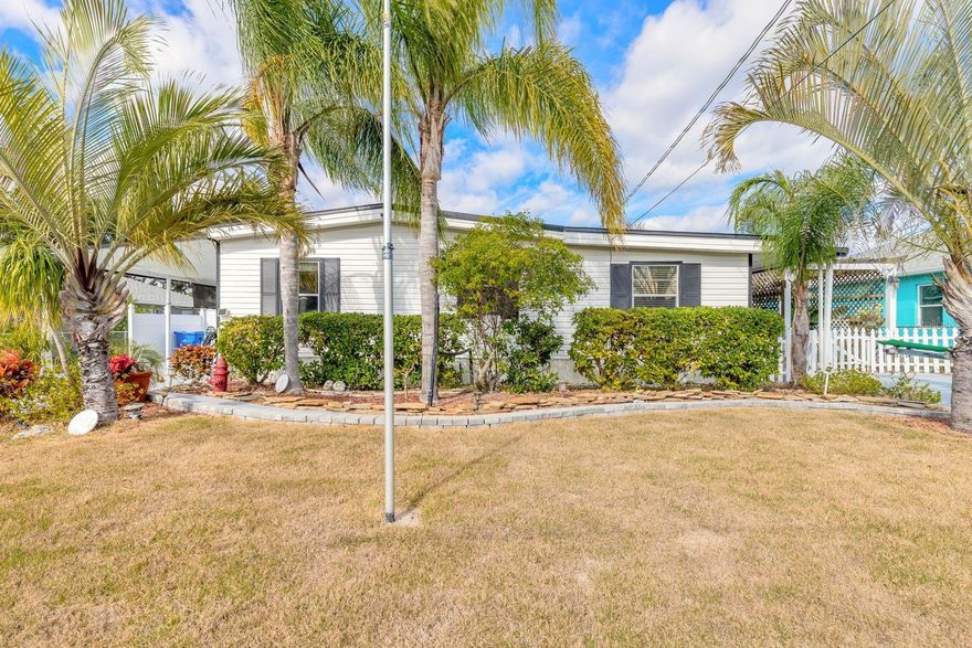 This home was designed for those who want it all - ELEGANCE, LUXURY, COMFORT AND WITH ENTERTAINING IN MIND. This 3 bedroom, 2 bath waterfront home with 75 feet of canalfront blends pristine condition with an elegant outdoor living lifestyle. Features include:  direct access to the intracoastal waterway and mosquito lagoon also known as the "REDFISH CAPITAL OF THE WORLD". The home itself is a dream come true offering a coastal retreat. Immaculate with bright open living spaces that flow to the tropical oasis and trellis gardens that await you outdoors. The airy remodeled kitchen is the "HEART OF THE HOME" with beautifuL cabinets, center island with storage, gorgeous backsplash, spacious pantry and elegant lighting where the chef can enjoy preparing the "CATCH OF THE DAY". Additional features include a gorgeous 12 x 20 room that currently is used as an office but could be a 4th bedroom, a large inside storage room currently housing an extra refrigerator, freezer and household extras but would be the perfect place for a game room, office, computer room, man cave or the must have "SHE SHED". You can enjoy the  "FLORIDA LIFESTYLE" from the screened in porch, open covered porch or covered dock. Drop your boat from the covered boatlift from right out your back door for a day of fishing or enjoyment. There's also an additional boatlift for smaller vessels and plenty of room for parking your "NEW TOYS". Covered carport with large shed/workshop. Now, there is a second driveway which is set up with water/sewer and electric for an RV.  Yard is completely fenced-in. The list for this home could go on and on but if you want the "LIFESTYLE OF YOUR DREAMS" then this is your chance to have it all, inside and out. All information is deemed accurate, measurements are approximate. Buyer and or buyers agent to verify all and any information.