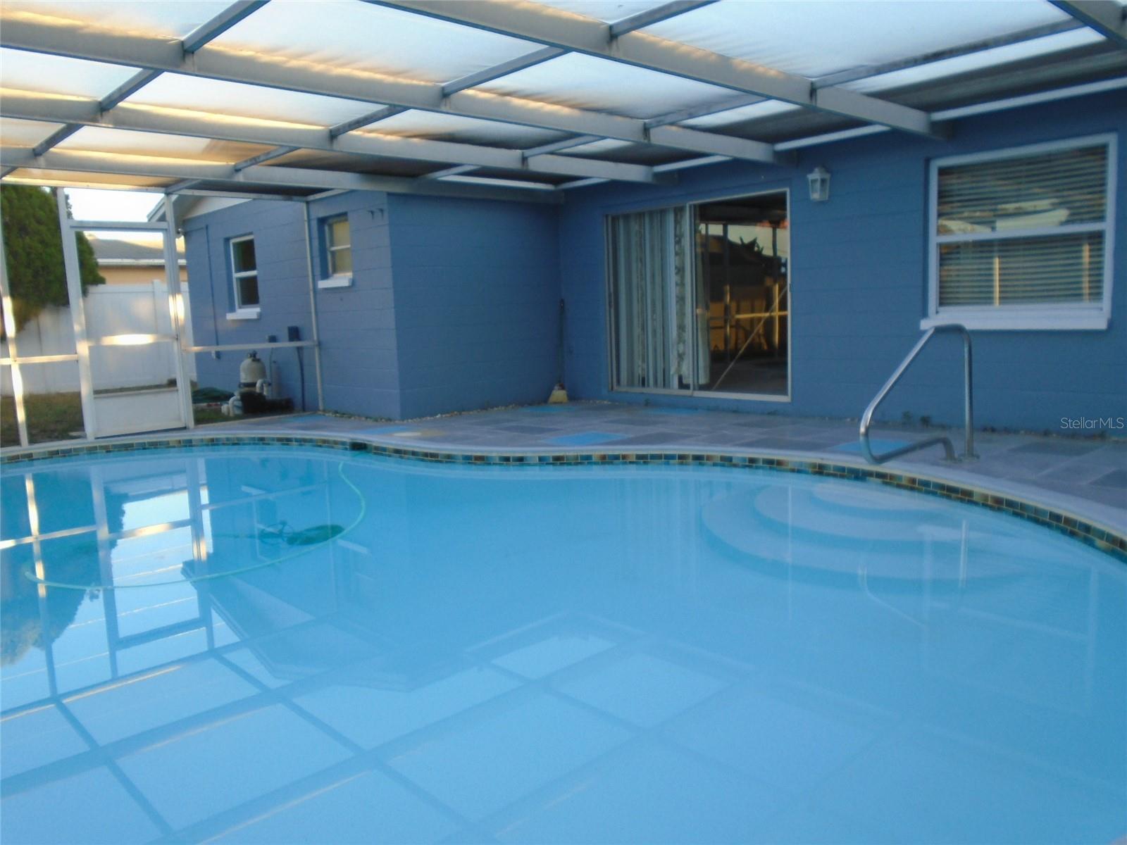 Pool Home — 3 Bed, 2 Bath Single-Family • Move-In Ready • Outside Flood Zone
 3-bedroom, 2-bath single-family pool home located outside the flood zone. Recently painted and well maintained, this clean home features tankless water heater and an  approximately 12-year-old roof in good shape, active Pasco County utilities, and an in-ground pool with full screen enclosure inside a fenced backyard — perfect for privacy and entertaining. Conveniently located near shopping, medical facilities and restaurants. 1-year home warranty included.