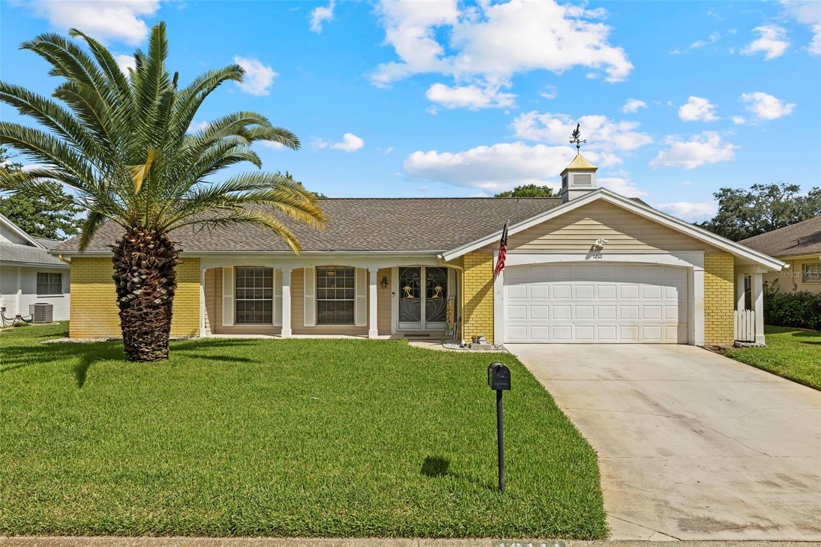 Charming 2 bed / 2 bath / 2-car garage home in the heart of Hudson! Whether you’re looking for a perfect starter home, vacation retreat, or investment property, this one checks all the boxes. Major updates of the big ticket items provide peace of mind: BRAND NEW ROOF (2025), HVAC SYSTEM (2025), and WATER HEATER (2023) (Plus a recent clean 4-Point Inspection and Wind Mitigation attached!). Inside, you’ll find tasteful upgrades including laminate flooring in the bedrooms and living area (no carpet throughout!), new bathroom vanities with elegantly tiled showers, and thoughtful built-in storage. The spacious kitchen offers ample counter space, newer stainless steel appliances, and a new disposal. Natural light fills the home, creating an open and airy feel. A split floor plan ensures privacy with a large principal suite on one side and a guest bedroom on the other, separated by a generous flex space—ideal for an office, den, or even an additional guest room (perfect for a Murphy bed or pull-out couch). You’ll also appreciate the full laundry room with shelving and sink, as well as a large screened lanai—perfect for peaceful mornings and evenings. The home is situated in the beautiful community of Beacon Woods with a very low HOA, close to the Suncoast Parkway for an easy commute to Tampa, and just minutes from the Gulf for boating enthusiasts.