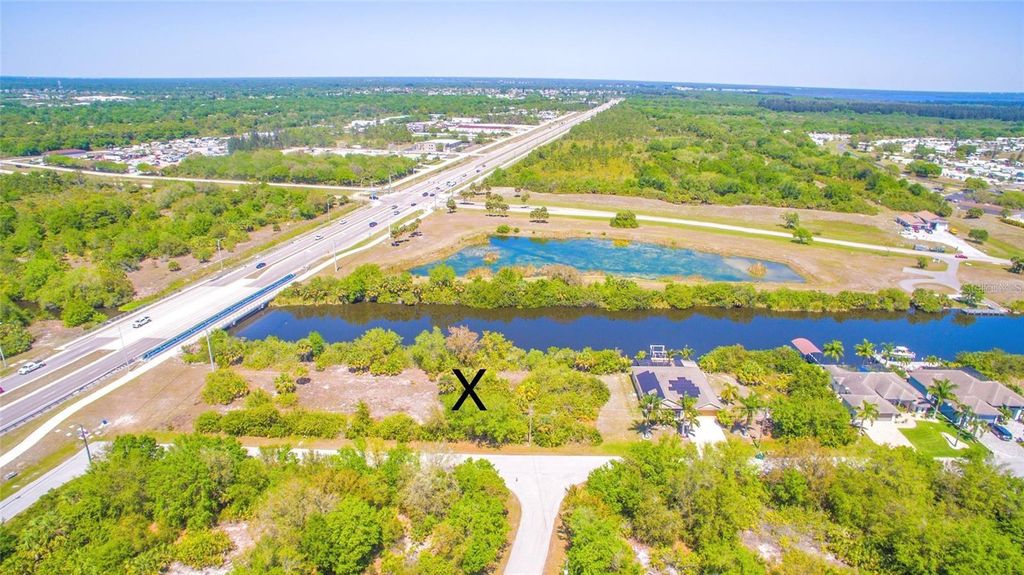 Photo of 13922 Orbit Avenue, Port Charlotte, FL 33981 (MLS # C7504516)