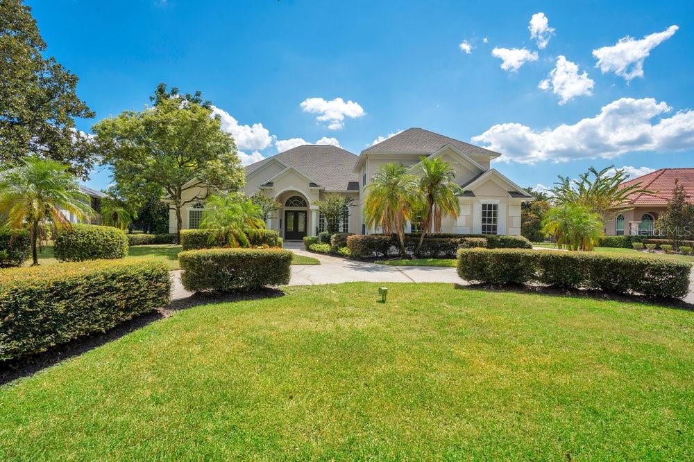 Rare find with Lawn care and pool maintenance are included. This beautifully maintained 5-bedroom, 4-bath custom pool home with 3-car garage now available for lease in the heart of Dr. Phillips. Set on a spacious 0.57-acre cul-de-sac lot, this home offers luxury, comfort, and convenience in one of Orlando’s most sought-after neighborhoods. From the circular driveway and mature landscaping to the elegant double-door entry, the curb appeal sets the tone for what’s inside. The interior features premium travertine flooring, vaulted ceilings, and abundant natural light streaming through large windows and French doors. The open-concept layout is ideal for both everyday living and entertaining, centered around a spacious living area with a custom wood-burning fireplace and a chef’s kitchen featuring stone countertops, stainless steel appliances, wood cabinetry, and a walk-in pantry.
French doors lead to a private screened-in outdoor oasis, complete with a sparkling pool, summer kitchen, and expansive deck—perfect for enjoying the Florida lifestyle. The primary suite is a luxurious retreat with dual walk-in closets, a soaking tub, separate shower, and sitting area. Secondary bedrooms are generously sized, and an oversized upstairs bonus room with a full bath and walk-in closet offers flexibility for a media room, guest suite, gym, or home office. Garage with epoxy floors provides ample parking and storage, and the property also includes a well water irrigation system and fresh interior/exterior paint.
Located just minutes from Restaurant Row, top-rated schools, shopping, theme parks, and major roadways, this home is move-in ready. Schedule your private tour today!