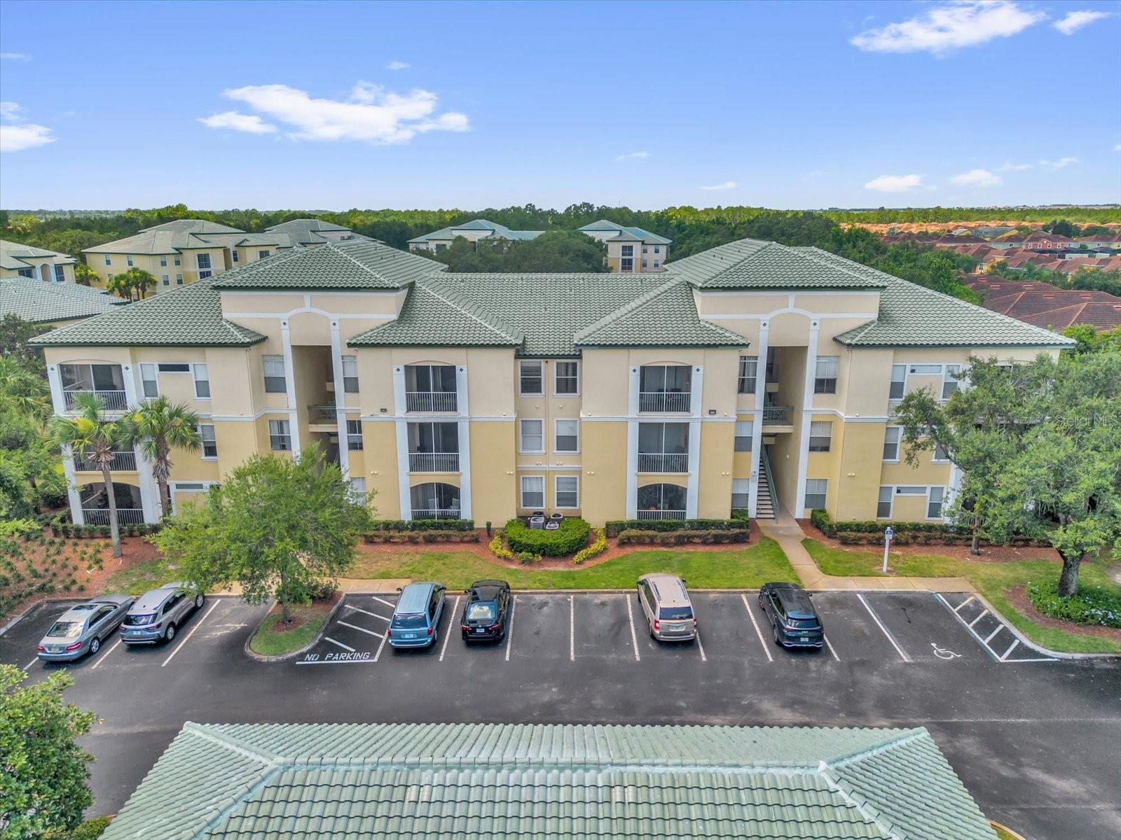 Welcome to this beautifully updated 2-bedroom, 2-bathroom corner unit in the gated resort-style community of Legacy Dunes, just minutes from Disney! Located on the second floor with lots of natural light, this fully furnished condo features a spacious open layout, walk-in closets, and a screened-in balcony overlooking serene pond views. Enjoy a host of amenities including two pools, a fitness center, tennis and basketball courts, playground, clubhouse, and more. With in-unit laundry, short- and long-term rental potential, and easy access to major highways, shopping, and theme parks, this move-in-ready home is perfect as a primary residence, vacation getaway, or investment opportunity. New AC 2025.