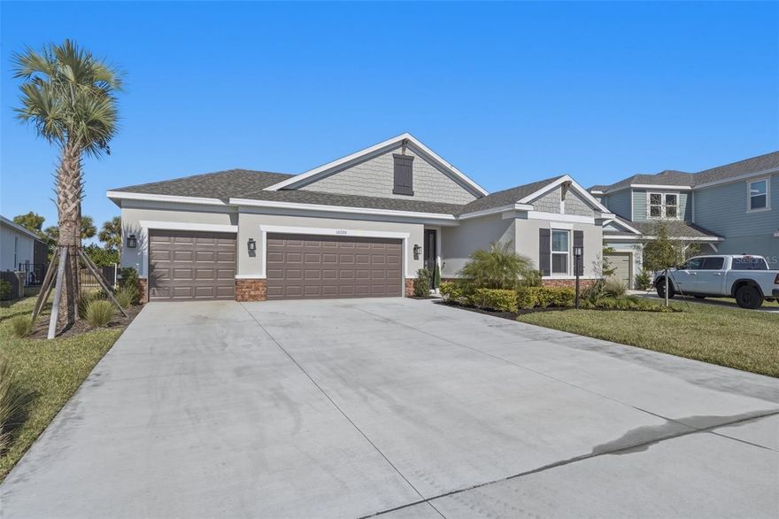 Welcome to this exceptional residence in Lakewood Ranch, Florida, ideally located within the highly desirable Park East at Azario community. Built in 2025, this stunning Antigua floor plan offers four bedrooms, a dedicated office, and an impressive collection of upscale, thoughtfully selected upgrades that create a home both elegant and inviting. All available upgrades have been thoughtfully completed in this home, offering a truly move-in-ready experience with elevated finishes throughout. Enjoy close proximity to Florida’s world-renowned Gulf Coast beaches, premier shopping and dining at destinations like UTC Mall, local boutiques and restaurants throughout Lakewood Ranch, fitness centers, medical facilities including Lakewood Ranch Medical Center, shopping plazas, parks, and so much more, placing everything you need just minutes from your doorstep.
Due to an unexpected executive relocation, this beautifully upgraded home is now available, creating a rare opportunity for a new owner. Meticulously maintained and thoughtfully designed, it offers a perfect blend of comfort, style, and everyday functionality.
From the moment you step through the striking glass front door, you are welcomed into a light-filled, open-concept space enhanced by additional recessed lighting throughout, 8-foot doors, crown molding, and beautiful luxury vinyl flooring. Designer features such as custom shiplap and accent walls, statement chandeliers, upgraded light fixtures, ceiling fans in every room, and a built-in fireplace with shelving add warmth and character.
The gourmet chef’s kitchen is the heart of the home, showcasing quartz countertops, glass-front cabinetry, stainless steel appliances, a built-in oven and microwave, and a premium refrigerator that crafts specialty ice, perfect for entertaining. Pocket sliding glass doors lead to a pavered back patio, creating a seamless indoor-outdoor flow ideal for relaxing or hosting guests.
The primary suite offers a peaceful retreat with a tray ceiling and a spa inspired bath featuring a soaking tub, seamless glass shower with rain head and handheld sprayer, and tile extended to the ceiling. A thoughtfully added door provides convenient access to the laundry room from both the hallway and the primary closet. All three bathrooms feature floor-to-ceiling tile for a refined, cohesive look, and pull down attic stairs provide easy access to additional storage.