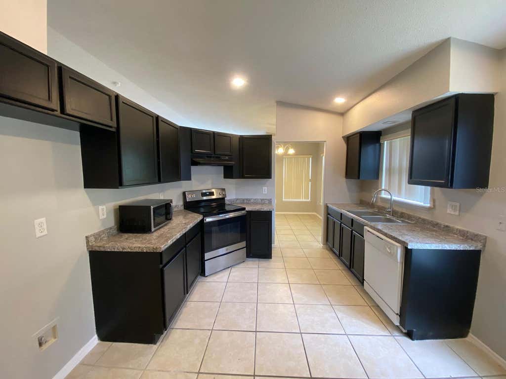 Photo of 1440 Timberbend Circle, Orlando, FL 32824 (MLS # O6420114)