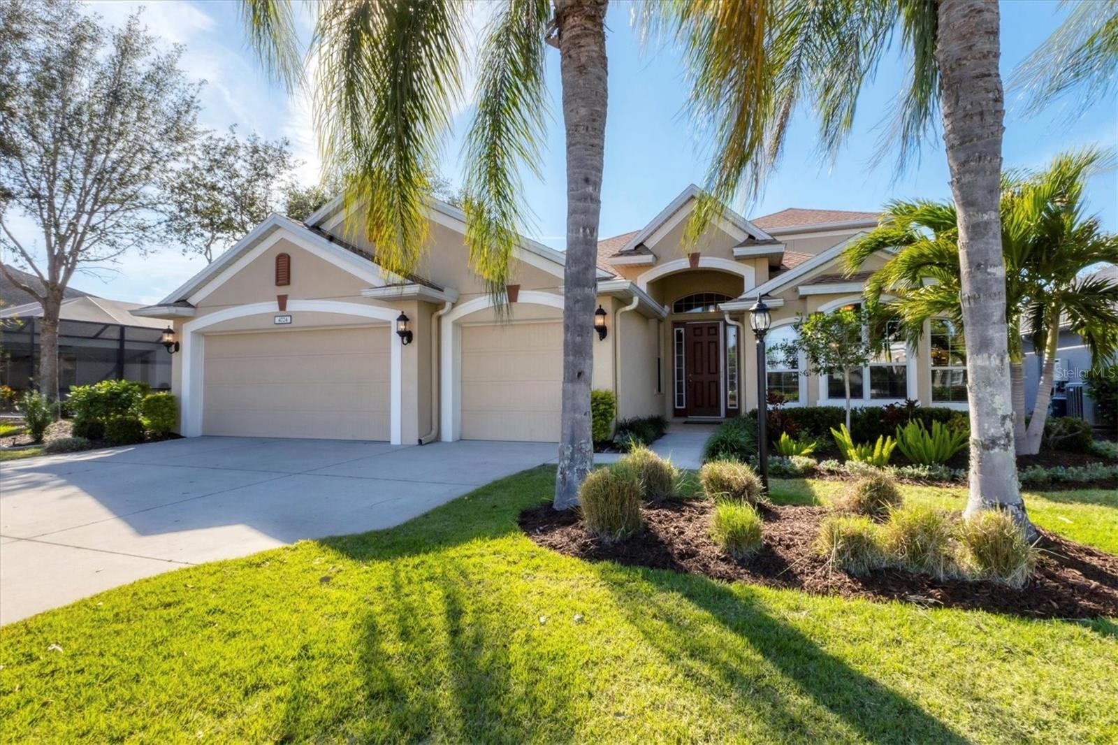 Welcome to this exceptional Cardel Homes Kingfisher 3 model offering four bedrooms and a den, three baths in the desirable Central Park neighborhood of Lakewood Ranch. The open concept kitchen and great room create a seamless flow for everyday living, featuring high windows, large island, breakfast bar, walk-in-pantry and built-in-desk. A separate dining room and living room provide additional space for more formal gatherings, while the eat-in area off the kitchen offers a cozy spot for casual meals. The private primary suite is a sanctuary, complete with dual sinks, soaking tub, large walk-in shower and an oversized closet. Two additional guest bedrooms are conveniently downstairs and share a full bath with direct access to the pool area. The spacious layout includes a large upstairs bonus room with a private bedroom and full bath, making it ideal for guests or a quiet retreat. Ready for a swim - The perfect saltwater gas heated 30 ft length pool provides for daily swimming laps ending with a relaxing 6-person spa! Enjoy this outdoor space with ceiling speakers connected to the in-door great room surround sound system. At the end of day, grill in the outdoor kitchen and tap the kegerator or retrieve a soda or sparkling water from the beverage cooler. This home is packed with premium features and recent upgrades, including Gunstock Oak laminate and tasteful tile flooring throughout, hurricane impact windows on the second floor and shutters on the ground level, a new roof in 2023, a new air-conditioning unit and heat pump in 2024, and a rescreened lanai in 2024. Additional highlights include an EcoWater Systems purification system, a surround sound system in the great room and lanai, and a freshly painted interior and garage floor. In one of Lakewood Ranch's sought-after communities, this home is just minutes from A-rated schools, shopping and dining. Residents of Central Park enjoy an abundance of amenities, including parks, nature trails, a sports complex, dog parks, a playground, a splash pad and vibrant monthly social events.