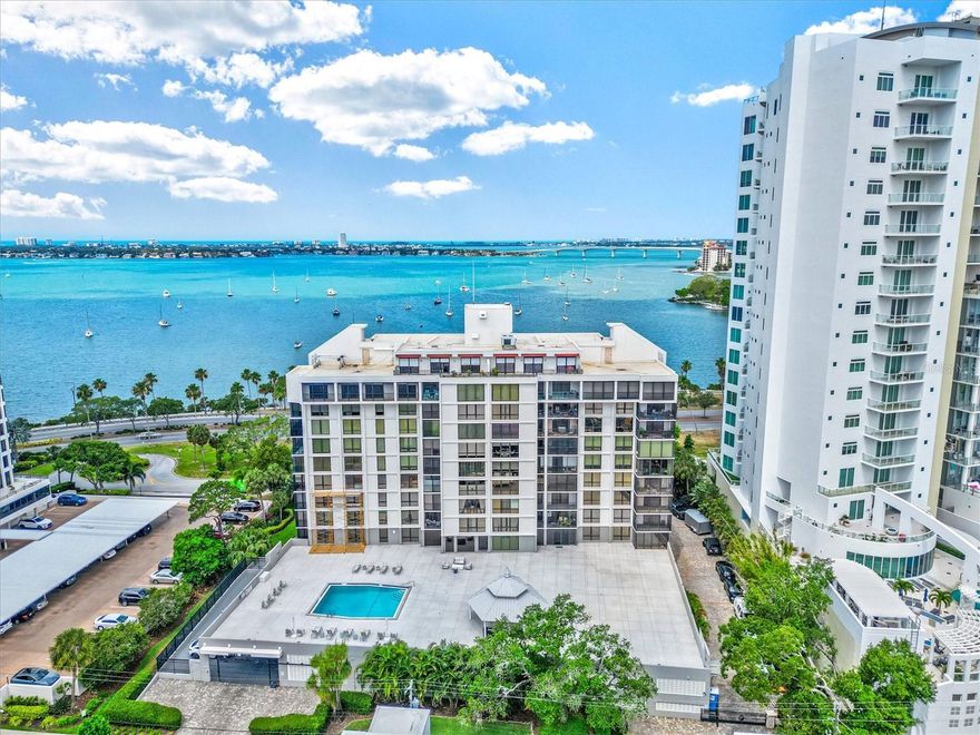 Discover a lifestyle that blends walkable downtown living with the relaxed coastal energy that makes Sarasota so special. This beautifully updated 1 bedroom, 1.5 bath condo at Essex House sits on the 9th floor and invites you to experience Sarasota from a new perspective. Floor to ceiling windows frame sweeping city views, with lush treetops and skyline scenery that feel both vibrant and peaceful at the same time.

From the moment you enter, the home has an easy flow. The designer kitchen opens naturally to the dining and living areas, creating a welcoming space to entertain or unwind after a day along Sarasota Bay. A versatile bonus area offers room for a home office, creative space, or occasional guest use. The enclosed balcony extends your living space and becomes the perfect spot for morning coffee or evening conversation while the city lights begin to glow.

The spacious primary bedroom offers generous closet space and a beautifully appointed en suite bath, creating a private retreat that feels calm and refined. Natural light fills the residence throughout the day, highlighting the thoughtful finishes and the connection to the city around you.

Essex House is one of Downtown Sarasota’s established luxury condominium communities, offering resort style amenities including a heated pool, fitness center, and welcoming social spaces. Here, you are moments from Marina Jack, Bayfront Park, Selby Gardens, boutique shopping, fine dining, the arts, and everything that defines the Sarasota lifestyle.

If you have been searching for a Downtown Sarasota condo for sale that offers comfort, convenience, and character, Unit 906 at Essex House delivers it all in an exceptional location near Sarasota Bay. This is where everyday living begins to feel like a getaway.