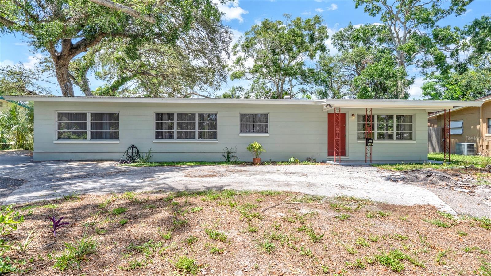 FANTASTIC 3BR/2BA HOME IN LAKEWOOD ESTATES, ST PETERSBURG! Yearly/Unfurnished rental. 1932 sq ft under roof. Home features terrazo flooring and laminate flooring, split bedroom plan, garage conversion for additional bedroom/office/mancave/playroom with wall a/c unit - second bath with washer/dryer connections, living room, dining room and family room! Kitchen has been recently remodeled with newer cabinets and countertop. This home has a nice floor plan to entertain family and friends. The 3rd br with closet, opens to a large screened lanai overlooking a great size fenced back yard. Home has newer central a/c and roof. Home has easy access to banks, groceries, pharmacy, fine dining, shopping, Eckerd College, and only a short drive to the sandy beach! $75 application fee each adult for credit check, background check, income verification and rental history. One small pet ok with $300NR pet fee. If you decide to apply for one of our properties, there is a $75 each adult application fee that is non-refundable. There is also a $150.00 Lease Admin Fee along with the Security Deposit and non-refundable pet fee if applicable. Anyone aged 18 or above who will be residing at the property must apply. All Rent Solutions residents are enrolled in the Resident Benefits Package (RBP) for $49.95/month which includes liability insurance, credit building to help boost the resident’s credit score with timely rent payments, HVAC air filter delivery (for applicable properties), our best-in-class resident rewards program, and much more! More details upon application.