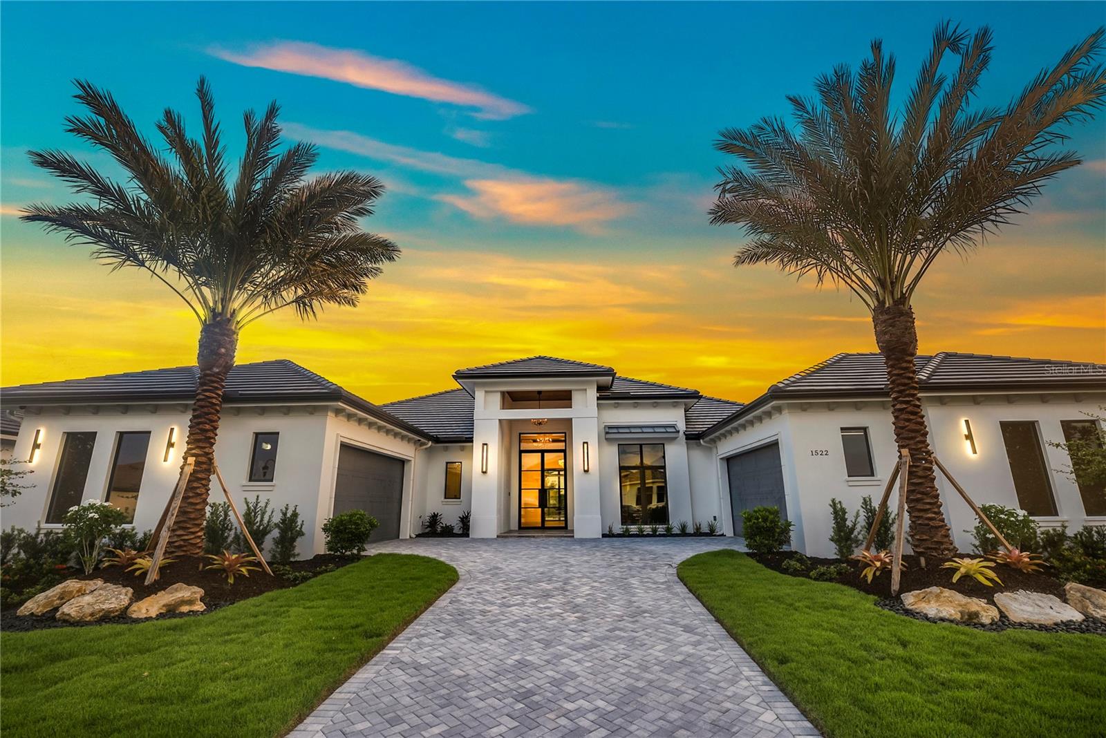 This exquisite home, featuring an open floorplan, is situated on a private lot with views of the Manatee River. Nestled within the 24/7 manned, gate-guarded community of The Islands at River Wilderness, this resort-style neighborhood offers effortless living surrounded by natural beauty and world-class amenities.
With 3,649 air-conditioned square feet, this 3-bedroom, 3.5-bathroom residence showcases stunning river views and a thoughtfully designed layout. The gourmet kitchen is equipped with top-of-the-line appliances and highlighted by a striking Cambria quartz island with waterfall edges that flow seamlessly to the wood flooring. The expansive great room includes a beautifully tiled entertainment wall and a built-in electric fireplace, creating a warm and inviting atmosphere.
Designed for both comfort and entertaining, the home’s open layout extends to generous outdoor living spaces. The luxurious primary suite features a spa-like bathroom with a soaking tub, dual-entry shower, and elegant tile accents.
This home features a top of the line Control4 home automation system with integrated security, lighting, audio, and window treatments.