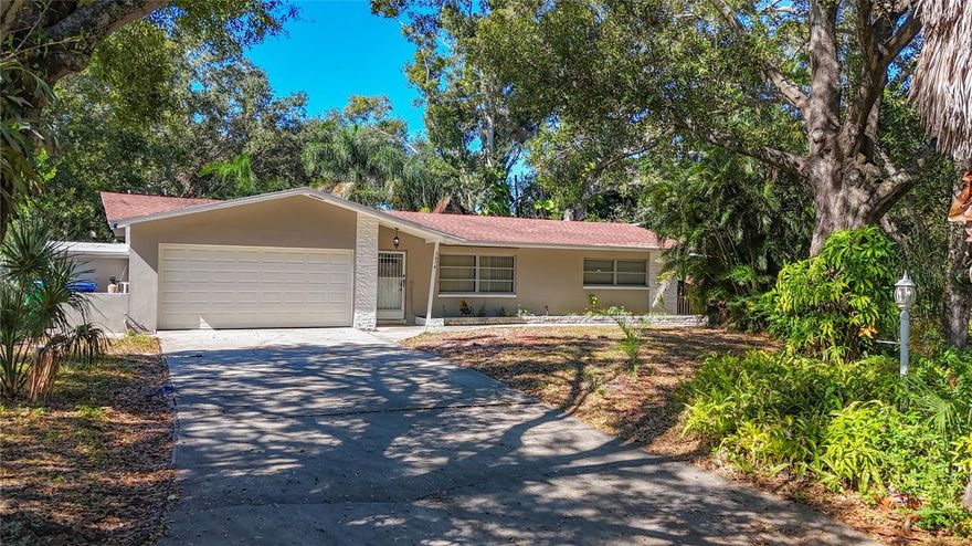 Available Now.  This 3-bedroom, 2-bathroom and  2-car garage home is nestled in a quiet cul-de-sac street of Clearwater. This home has 2 driveways.   Enjoy the beautifully upgraded kitchen with quartz island, ample closet space in each bedroom, and a Florida bonus room is perfect for a home office or entertaining. The kitchen features gorgeous quartz countertops, and the bathrooms have been beautifully renovated. Beautiful laminate flooring.  NO Carpet.  Enjoy your coffee or afternoon tea on  a deck overlooking the creek where you can watch wildlife from the comfort of your own home. This beautiful Clearwater home offers space, warmth, and functionality in a central location. Enjoy easy access to stunning Gulf Coast beaches, Tampa International Airport, downtown Clearwater and St. Petersburg, and a variety of dining, shopping, and hospitals.  Call or text Mindy for a private showing before it is gone!
