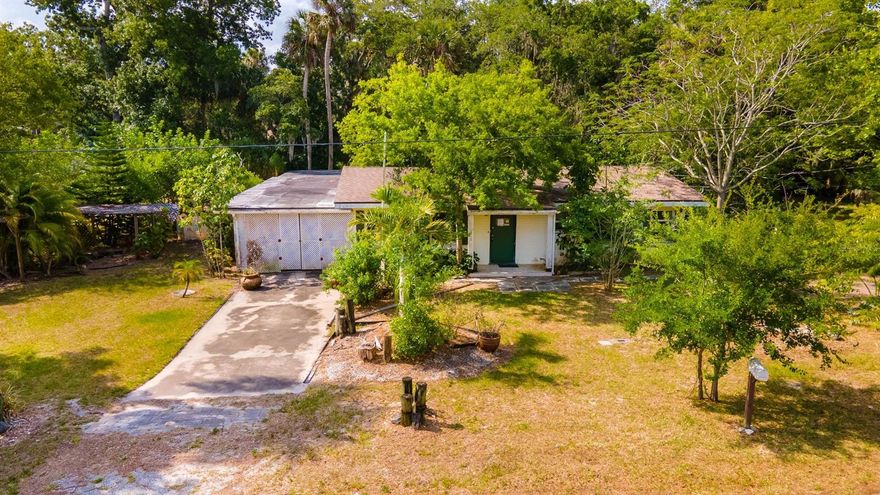 Enjoy this 3 bedroom/1 bath home situated on a private canal with small boat access to intracoastal. You will fall in love with the property which sits on a double lot surrounded by gorgeous trees and wildlife and is seconds away from a walk down Riverside Drive.  There is a deep private well for irrigation use. The property also features an onsite bomb shelter. The home is in foreclosure and is being sold " As Is". If demolished, the property can be subdivided into two lots. Measurements are approximate. All information is intended to be accurate but is not guaranteed. ;Water: City
