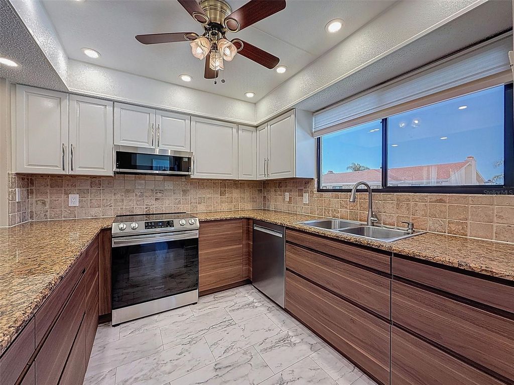 Photo of 9981 Eagles Point Circle #4, Port Richey, FL 34668 (MLS # W7880091)