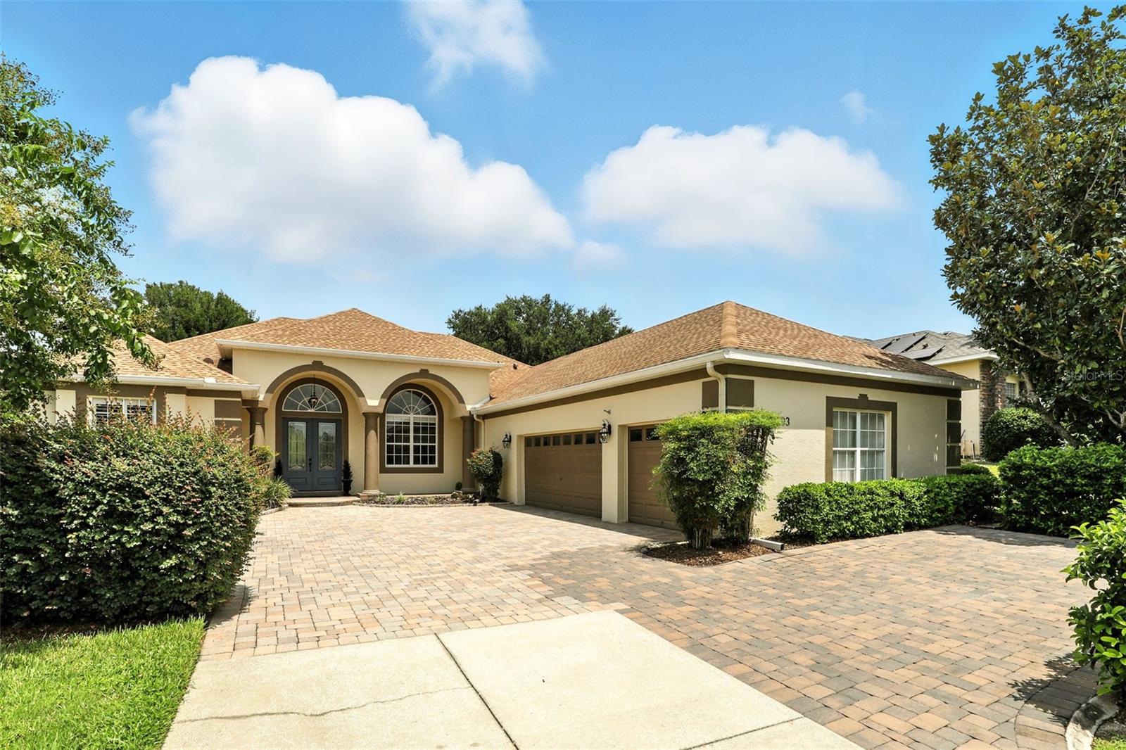 Welcome to this breathtaking 5 bedroom 3 bathroom 3 car garage home in Montverde on almost 3/4 of an acre. Impeccably maintained and beautifully upgraded, this home is a showstopper, boasting over $130,000 in high-end enhancements throughout. Step through the full-light double entry doors, you’ll immediately be greeted by clean lines, soaring ceilings, and oversized windows filling every corner with natural light. The elegant crown molding, tall premium baseboards, and new engineered hardwood flooring throughout the entire home will create an ambiance of understated luxury throughout. The formal dining showcases expansive views of the pool, spa, and backyard through one of three oversized sliding glass doors. Nearby, a cozy front sitting room offers the perfect place to relax or entertain guests. At the heart of the home, the fully remodeled chef’s kitchen is a culinary dream, boasting custom cabinetry, granite countertops, upgraded appliances, and a walk-in pantry. With the open-concept design, the kitchen flows seamlessly into the living area, where another three-panel sliding glass door provides private views of the backyard oasis. The primary suite feels like your own private retreat, set apart in its own wing of the house. It also features two walk-in closets, an updated spa-like bath with a freestanding soaking tub, and sleek custom separate twin vanities. Two large windows with plantation shutters and an oversized sliding glass door leading to the pool bringing in natural lighting. Just past the kitchen and living on the opposite side of the home, you will find bedrooms two and three just through their own foyer. Adjacent to the two bedrooms sits a full guest bath with its own pool access. Further down the hall, you will come across bedrooms four and five. They are separated by another full guest bath and well-appointed laundry room with ample cabinetry for hideaway storage. Step outside to the resort-style backyard, thoughtfully designed for year round enjoyment, featuring a brand-new outdoor kitchen. Enjoy the private, heated, saltwater pool and spa all year round. With a low HOA fee, and the location perfectly situated, don’t miss your opportunity to live this incredible lifestyle.