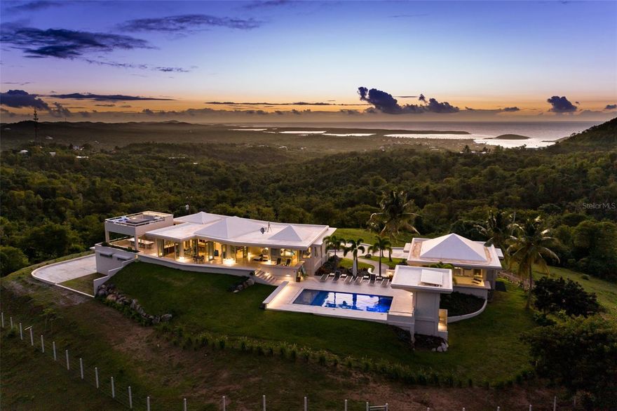 Casa Limones - A Private Oasis

Casa Limones represents a once in a lifetime opportunity to own a newly renovated ten acre estate in the exclusive La Llave sector of Puerto Real on Vieques Island.  Well known local architect Stanley Hutchinson designed and oversaw the original construction as well as designing and overseeing the renovations and additions that were completed in 2021.

Sitting atop one of the highest peaks on Vieques, Casa Limones stands alone in terms of privacy, luxury, comfort and beauty. Offering stunning 360° views of the magical island of Vieques, this turnkey estate has it all and is fully fenced and accessed by electronic control.. The Modern design seamlessly combines indoor and outdoor spaces so that no matter where you are the views take your breath away.

The dream of Casa Limones began in the mid 1980's as the original owners contemplated and experimented with various locations for siting the house to experience the ideal sunset.   Later they began the design phase for the property with Stanley Hutchinson and the original home was finished in 1989.

The house was created from the idea of a series of pavilions with the main structure housing the interior living space, primary kitchen, dining room, laundry as well as one of four bedroom and bathroom suites.  

The master bedroom suite pavilion sits across a covered breezeway from the main living with fabulous ocean views and access to the pool area.   

Two additional en suite bedrooms are located in the guesthouse pavilion with living room and secondary kitchen.

The swimming pool area includes plenty of room for lounging and features a half bath and a sauna room.

The new outdoor kitchen has a polished, exposed aggregate dining table for 12 and  a professional Bull pizza oven.  This will be a favorite area for entertaining family and friends.   A stairway leads to a new deck above the outdoor kitchen that features a Bullfrog hot tub with multiple seating areas and is perfect for sunbathing or star gazing. 

Some additional features include security system including cameras controlled by a professional system, Control 4 sound system, a 46,000 gallon water storage/cistern, solar pool motor,  Caribbean Clear pool system,  a whole house generator,  golf pitching green with three Tee boxes, helicopter landing space, oversized two car garage, climate controlled storage, beautiful Travertine tile work inside and out,  fully air conditioned and privacy unrivaled on Vieques Island.

Casa Limones is being sold move in ready and fully furnished excluding the owner's personal items and art collection.