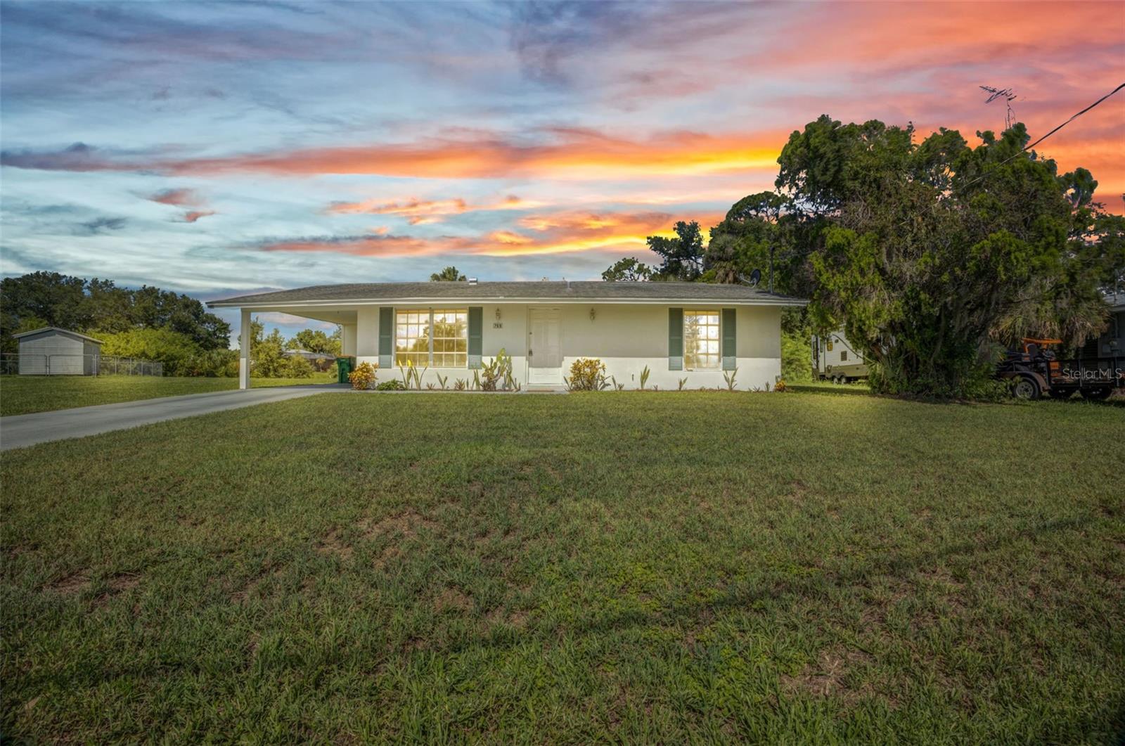 Under contract-accepting backup offers. 130' on water CANALFRONT HOME ON OVERSIZED LOT WITH DIRECT ACCESS TO THE CRESTVIEW WATERWAY! This 2-bedroom, 2-bath Florida ranch-style home is conveniently located to all things Charlotte County and offers a comfortable 917 square feet of living space on a generous 0.41-acre lot with approximately 130 feet of brackish water frontage. Enjoy fishing, kayaking, and serene water views right from your backyard. The lot's irregular shape provides added privacy and space, with mature landscaping and a charming 1-car carport.
Inside, you'll find a cozy layout featuring a carpeted living and dining area, linoleum-floored kitchen, and spacious bedrooms, each with built-in closets. The enclosed porch/Florida room provides extra living space or the perfect spot to relax and take in the canal view. Practical updates include central air and electric heat, public water, septic, and ceiling fans throughout.
Located in a peaceful neighborhood with no HOA, this property is just a short drive from Port Charlotte Beach Park, Charlotte Harbor, numerous golf courses, and popular dining spots like Donato’s and the Twisted Fork. Grocery shopping and medical facilities are nearby also. Excellent nearby schools include Meadow Park Elementary, Murdock Middle, and Port Charlotte High.
This HOUSE DID NOT FLOOD during the recent storms, according to personal representative. The house itself is NOT in FLOOD ZONE, but street and canal are. Septic tank just pumped out and inspected 6/2025. New A/C 3/2022, roof 3/2010 (check out a 203K loan for new roof), new water heater June 2025.
