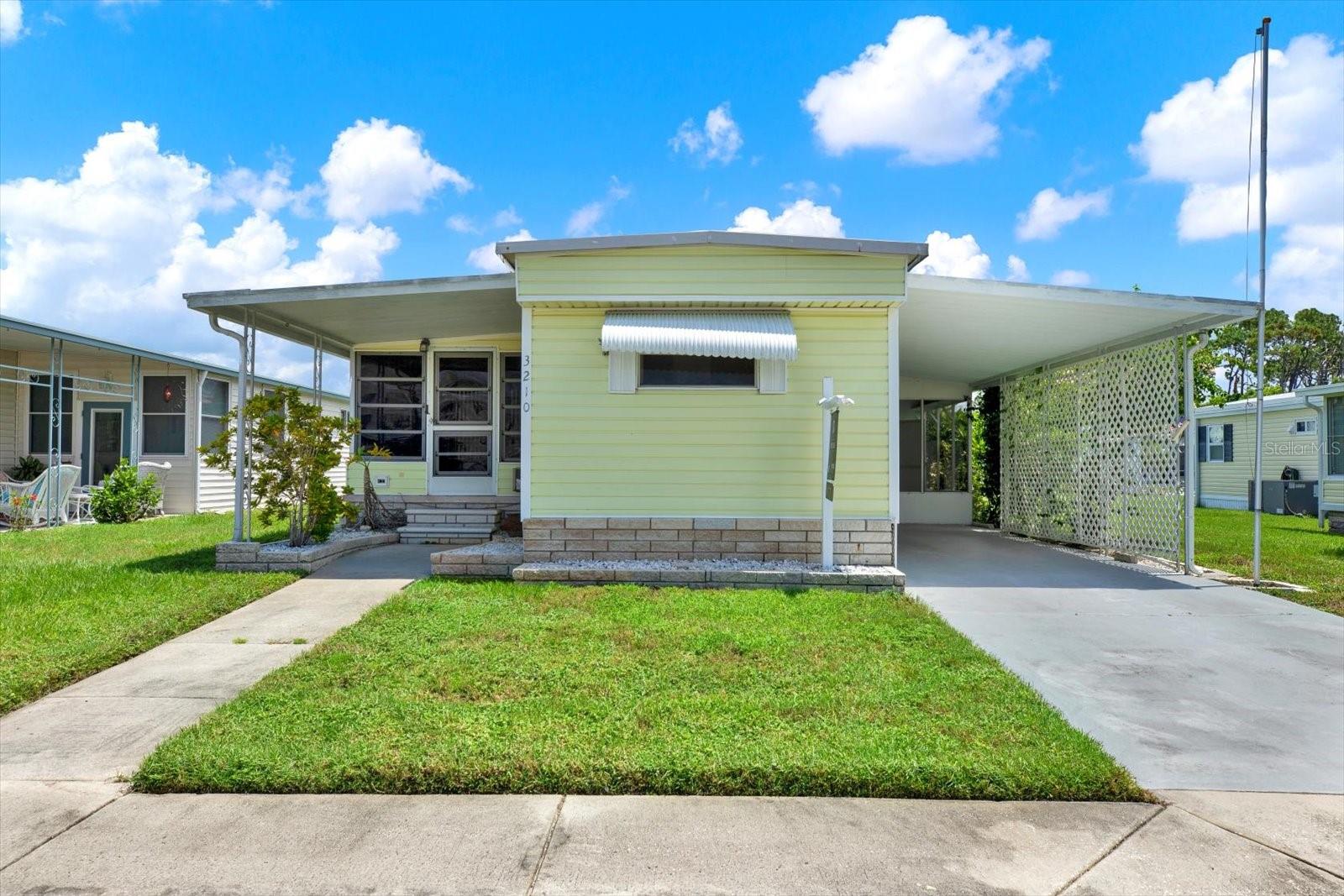Photos virtually staged.
Back on the market and better than ever! This renovated and move-in-ready 2-bedroom, 1.5-bath home is the perfect Florida retreat—ideal as a full-time residence or seasonal getaway. Located in a LAND-OWNED , 55+ community with a LOW HOA of just $143/month, this property offers incredible value, comfort, and a long list of recent updates!
Major improvements completed in 2025 include: new subflooring in both bedrooms and new flooring throughout the home, all new outlets and switches, new ceiling fans and lighting fixtures in the kitchen, living room, and laundry area, new front door, new window sills, a freshly painted interior. Plumbing updates include new shutoff valves, new supply hoses, and new toilets. The full bath features a brand-new shower enclosure and vanity area. The porch area has also been improved with a new ceiling fan, seal coating of the roof, and new exterior lighting. The laundry room received new wiring and lighting. Additional updates include updated vapor barrier, water lines, and A/C ducts.
Inside, you’ll find a bright white kitchen filled with natural light, easy-care laminate flooring through-out for easy maintenance, and both bedrooms have built-in storage. One bedroom features a private half bath, and the full bathroom offers a walk-in shower with glass doors and a vanity area. The second bedroom can comfortably accommodate guests or be used as a home office. The spacious Florida room is surrounded by windows, COOLED WITH IT'S OWN A/C UNIT, and perfect for entertaining or relaxing. A large screened-in side room and INCLUDED washer and dryer add to the home's functionality.
This desirable 55+ community has a welcoming, vacation-like atmosphere with NO LOT RENT! The LOW MONTHLY HOA FEE of $143 includes ground maintenance, private roads, trash removal, a reserve fund, and access to amenities such as a year-round heated pool, shuffleboard courts, and a clubhouse with lots recreational events & planned activities. Conveniently located near shopping, dining, US-19, the Suncoast Expressway, Pinellas County, and Tarpon Springs, this location offers both privacy and easy access to everything you need.