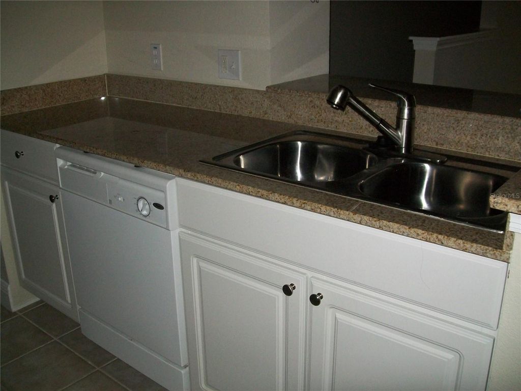 Photo of 12807 Madison Pointe Circle #203, Orlando, FL 32821 (MLS # O6396901)