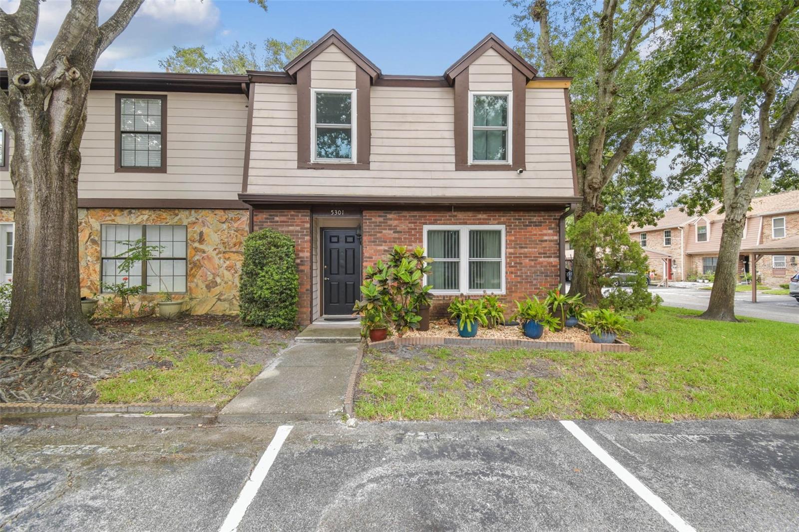**MULTIPLE OFFERS RECEIVED - HIGHEST AND BEST DUE BY 11:59PM EASTERN ON SUNDAY, SEPTEMBER 7TH. OFFERS WILL BE REVIEWED WITH THE SELLER ON MONDAY, SEPTEMBER 8TH.**
PRICED TO SELL! Welcome to 5301 Putnam Ct, a 3-bedroom, 2-bathroom end-unit townhome that offers comfort, convenience, and the chance to make it your own. Tucked within the established community of Carrollwood, this residence has had most of the major structural items updated in recent years, giving you a solid foundation to enjoy from day one.
The main living space is open and versatile, with the kitchen overlooking the living room to keep everyone connected whether you’re cooking, relaxing, or entertaining. From here, sliding glass doors open to a screened-in porch that extends your living area outdoors — perfect for morning coffee, weekend reading, or casual get-togethers.
One of the home’s most appealing features is its layout. With three bedrooms and two full bathrooms, there’s room to spread out without losing a sense of connection. The first-floor bedroom with an adjoining bath adds everyday convenience, while two additional bedrooms upstairs and another full bath create options for guests, a home office, or additional living space.
Outside, the lifestyle continues. The community pool is just a short walk from your door, making it easy to enjoy sunny Florida afternoons without ever leaving the neighborhood. Two assigned parking spaces, one covered and one open, provide everyday ease and peace of mind.
This property is move-in ready as it stands but also holds incredible potential for those who enjoy adding their own touches. Whether you’re looking for a home you can personalize over time or a reliable property in a convenient Tampa location, 5301 Putnam Ct delivers a balance of practicality and possibility.
Roof & Gutters - July 2025, Impact Windows - 2020, HVAC - 2021, Water Heater 1-2 years old