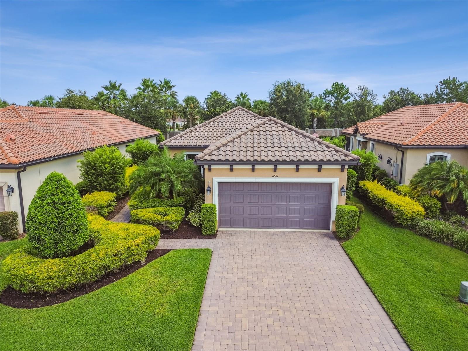 RESORT-STYLE living at its finest in the sought-after GATED community of Esplanade at Starkey Ranch! Located in the heart of Odessa, FL, is this move-in ready and meticulous ROMA floor plan, built in 2017, by Taylor Morrison. Situated closely to BOTH front and back gates and walking distance to the resort-style amenity center, this 2 bedroom, + bonus room/den/office, 2 full bathroom home, is sure to please. The exterior screams luxury with tile roof, mediterranean design, and fresh Florida landscaping. Its like walking through your own nature preserve as you come up to the side entry door. Once inside, take note of the 8 ft doors, beautiful crown molding in the tray ceilings and the 5 1/4 inch baseboards. Modern and sleek luxury laminate flooring has been placed throughout the entire home. Open floor plan allows easy entertaining and conversation. The large living space with high ceilings is cozy and full of natural light between the windows and the triple panel sliding glass doors with motorized privacy shades. All windows have plantation shutters for added elegance. The primary bedroom is located in the back of the home for privacy and offers a bay window to relax and view the pool. Tray ceiling and ensuite with dual sinks, stylish quartz countertops, walk-in shower with glass doors and decorative tile design, and spacious walk-in closet.
The kitchen is light and bright with not only a picturesque window, but high level quartz counter tops, under cabinet lighting, soft close drawers , wood drawer pull-outs, upgraded stainless steel appliances/gas range, and modern glass backsplash. There are added electrical outlets above the cabinets as well as throughout the home. Down the arched hallway you have a bonus room to the left that can be an office, a den, a playroom, or whatever you desire. There is a stunning full bath to your right with entry from the hallway and the 2nd bedroom. Beautiful light tiled walk-in shower with glass door is perfect for guests. The laundry room with utility sink is right inside from the garage door and has had cabinets placed for additional storage. The EXTENDED 2 car garage provides extra overhead storage. Water softener with purifier is in place. There is a pull down garage screen for summertime enjoyment and the garage door is insulated which allows cooler temps. All closets have custom wood shelving. Your outdoor oasis awaits you. Pebble-Tec POOL with bowled water features, electric pool heater and lights for a colorful evening are just a few incredible upgrades. Newer upgraded screen enclosure (2024), pool vacuum, extra hose bib for convenience, and extra exterior electrical outlets. The outdoor kitchen finishes this one-of-a-kind home off featuring sink, granite counter top, a Twin Eagles GAS grill hooked-up to house, a Sedona refrigerator, and stainless steel drawers/cabinets.
Interior has security with motion sensors. Exterior is prewired for security cameras. Click on the links for the visual walk through and video.
